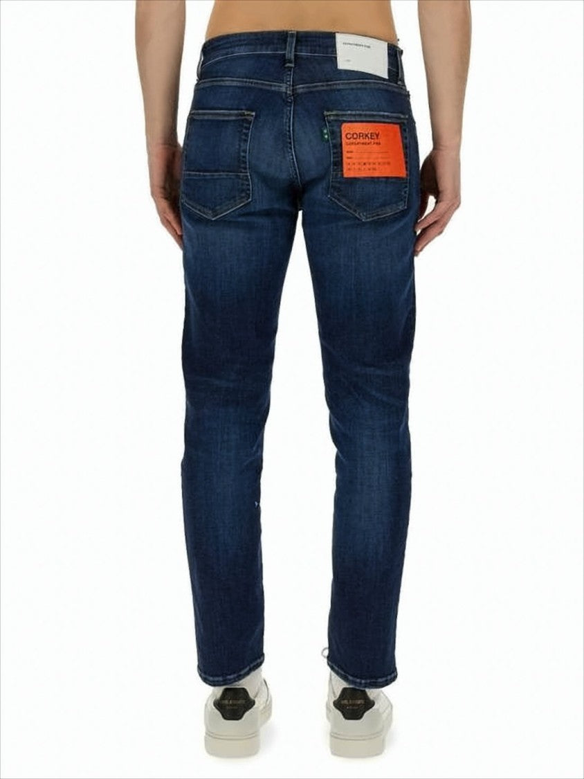 Slim Fit Denim Pants With Tapered Leg And Distinctive Accents