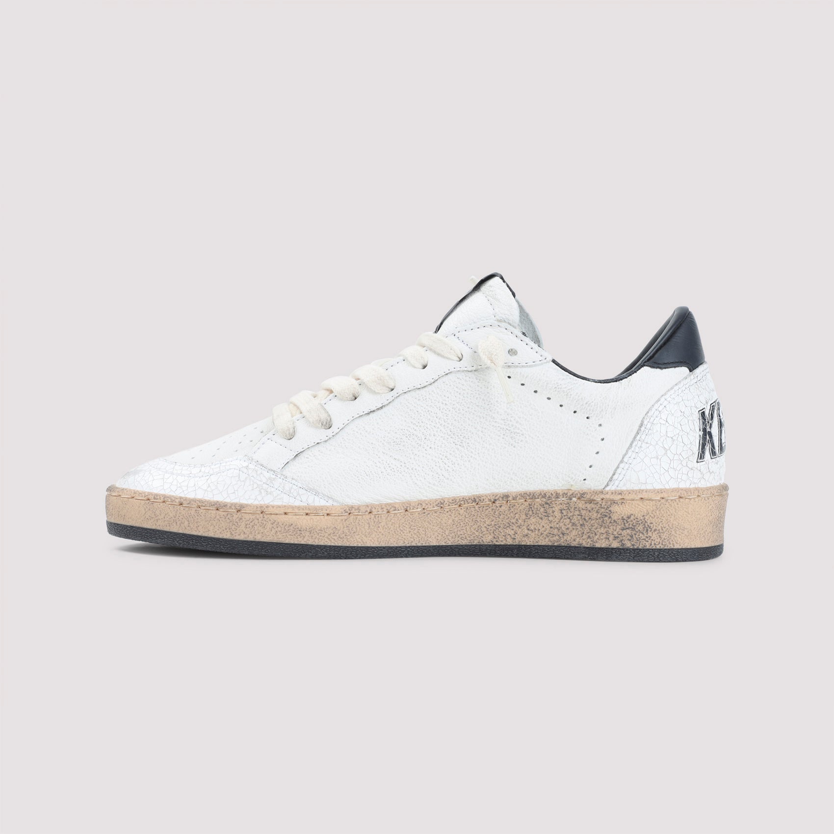 Textured White Leather Low-Top Sneakers With Black Star Detail