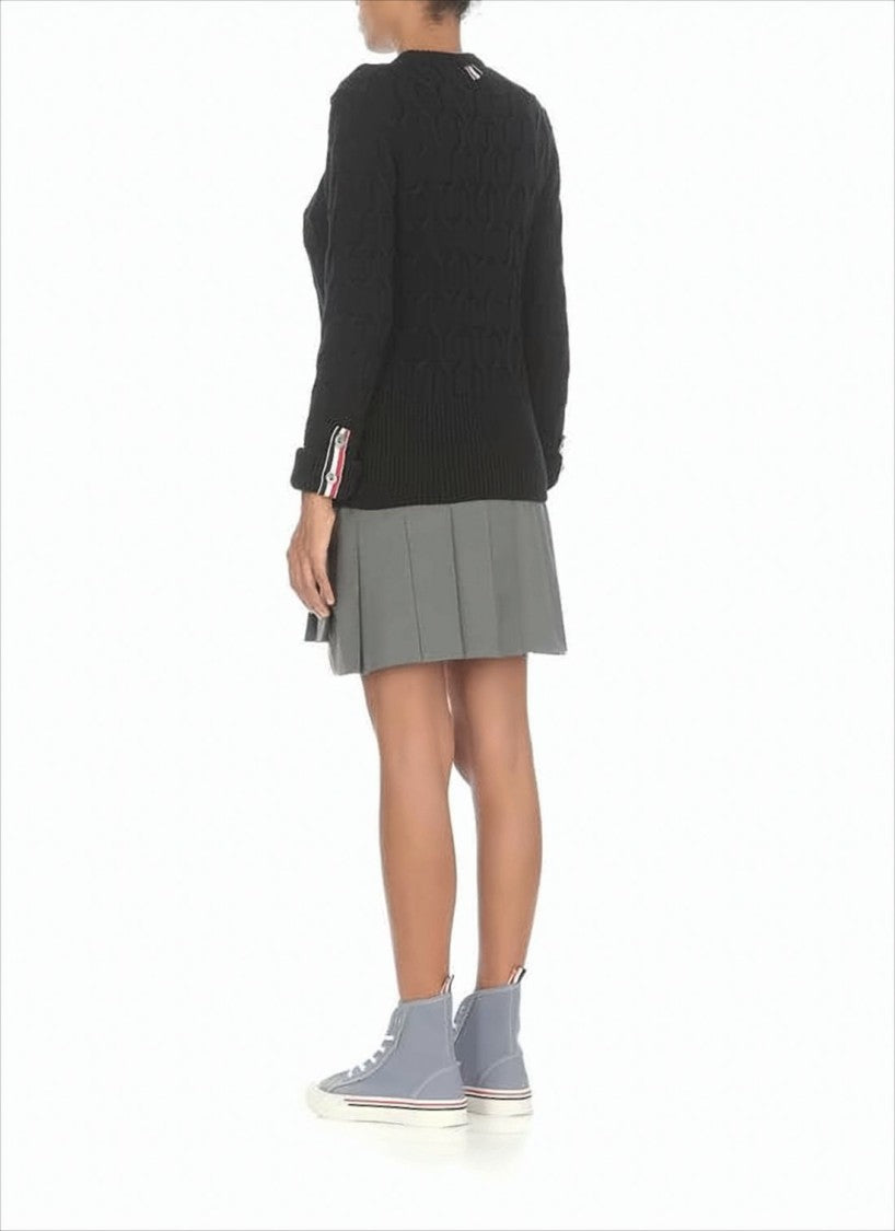 Structured Pleated Wool Mini Skirt with Distinctive Accents