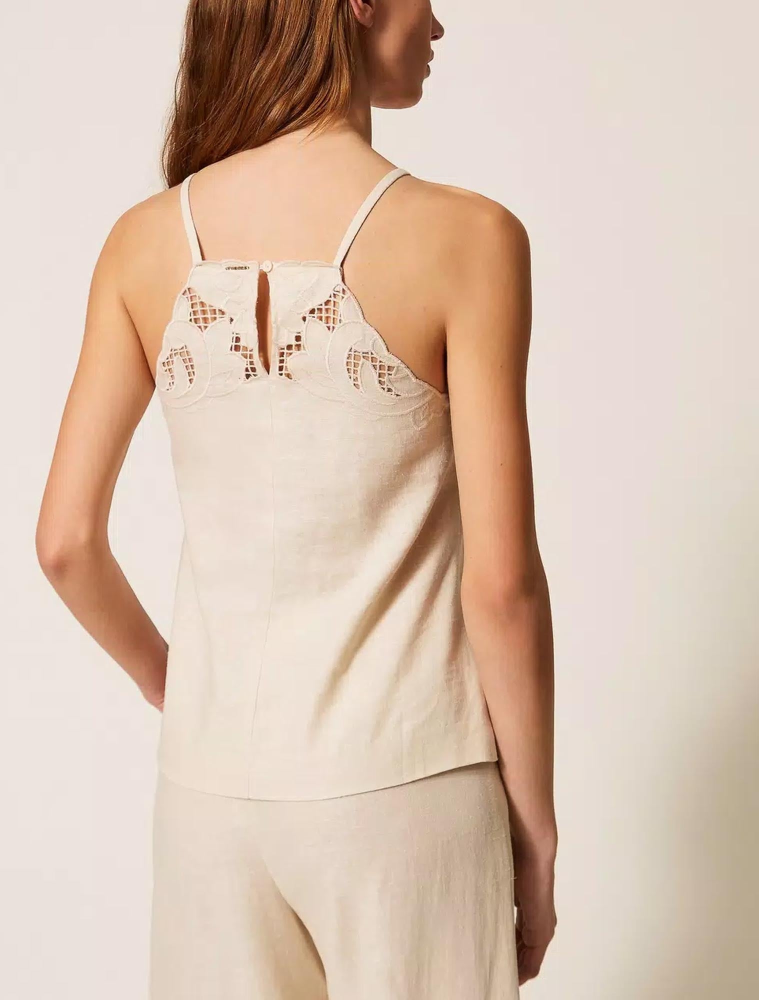 Sleeveless Top with Cut-Out Floral Embroidery