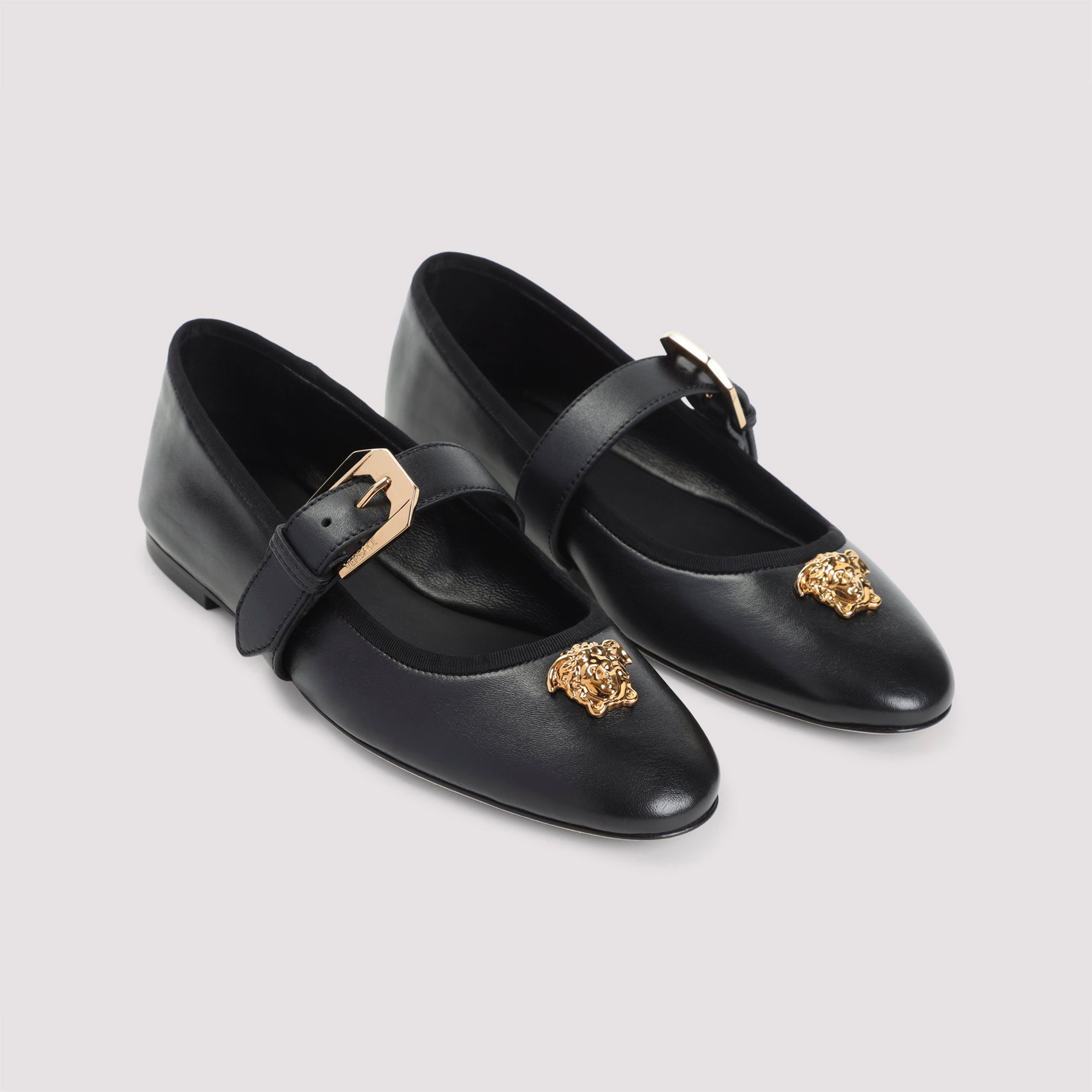 Pointed Toe Black Leather Flats with Gold Medusa Accents