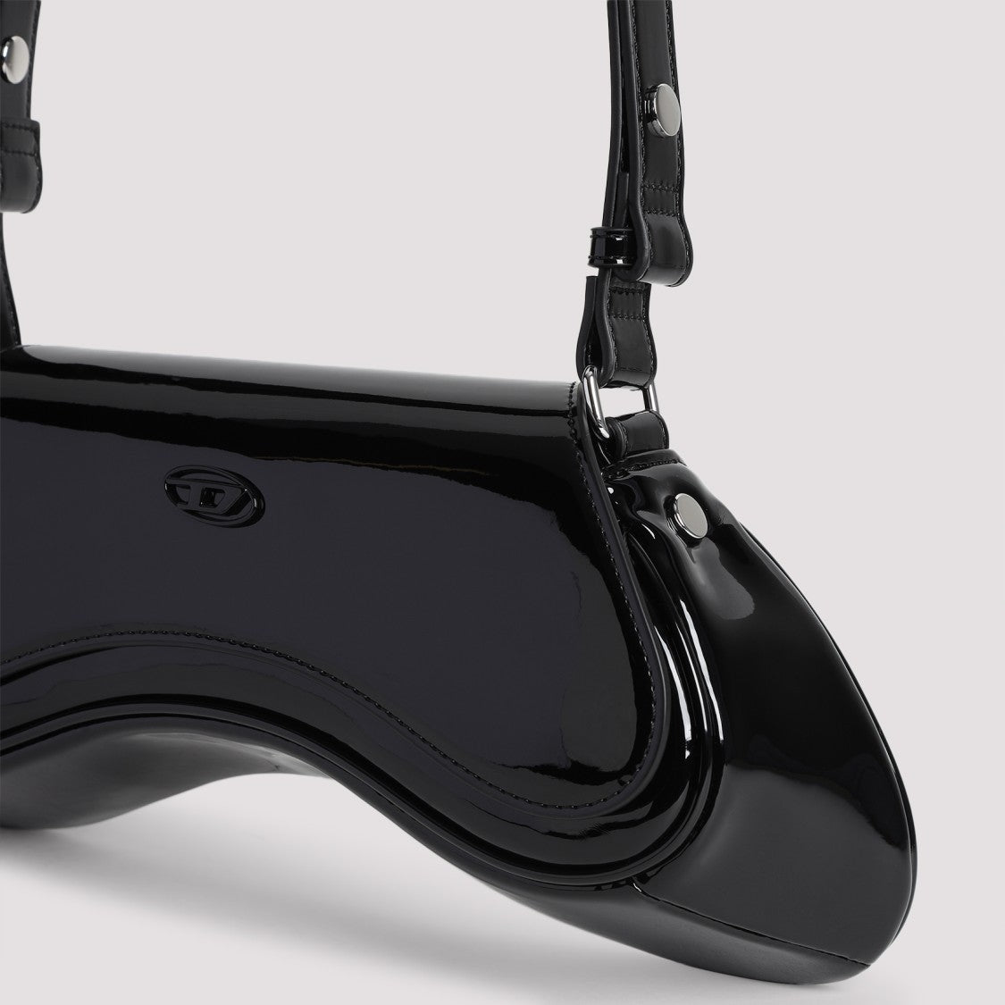 Joystick-Inspired Black Shoulder Bag With Magnetic Closure