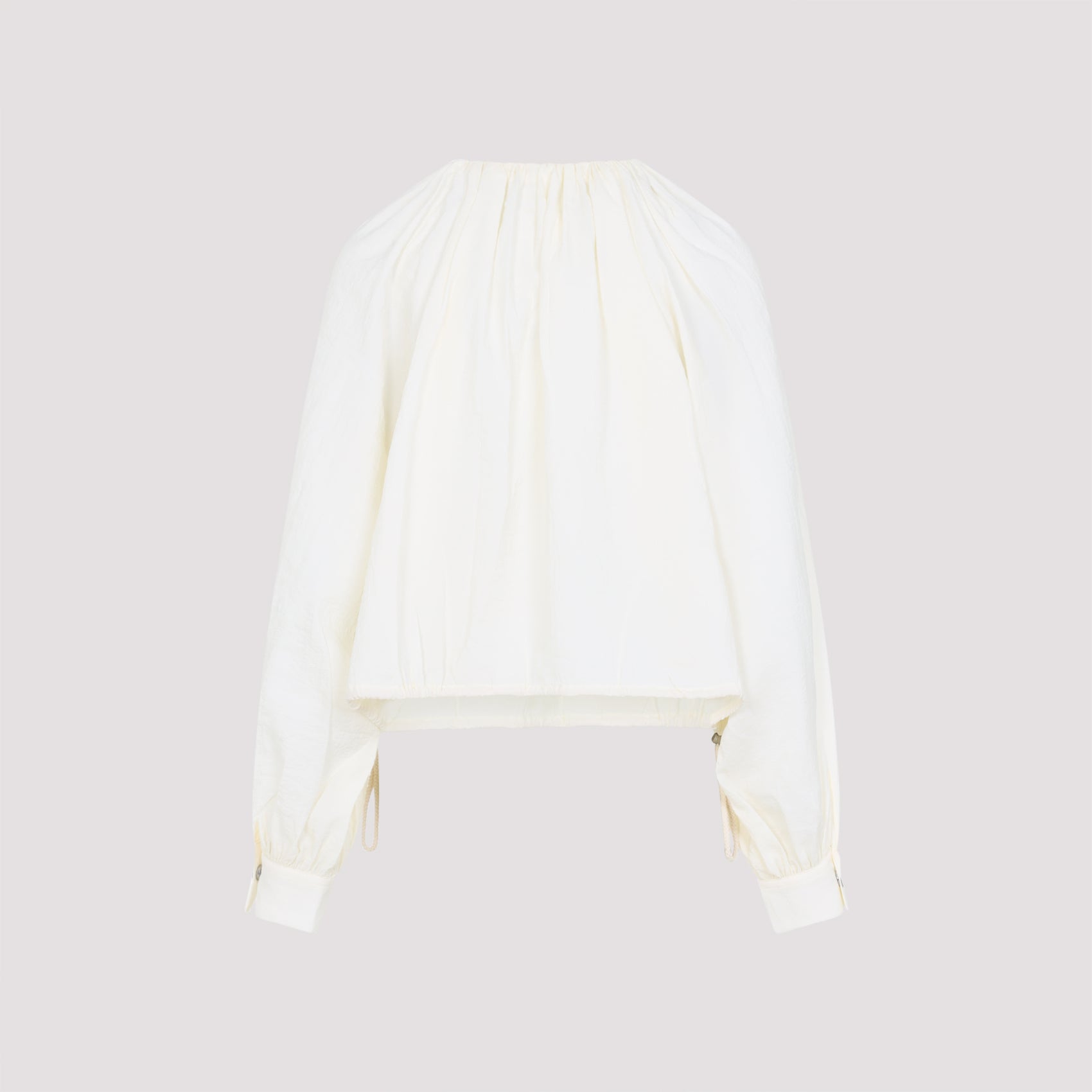 Long-Sleeved White Top with Adjustable Hem