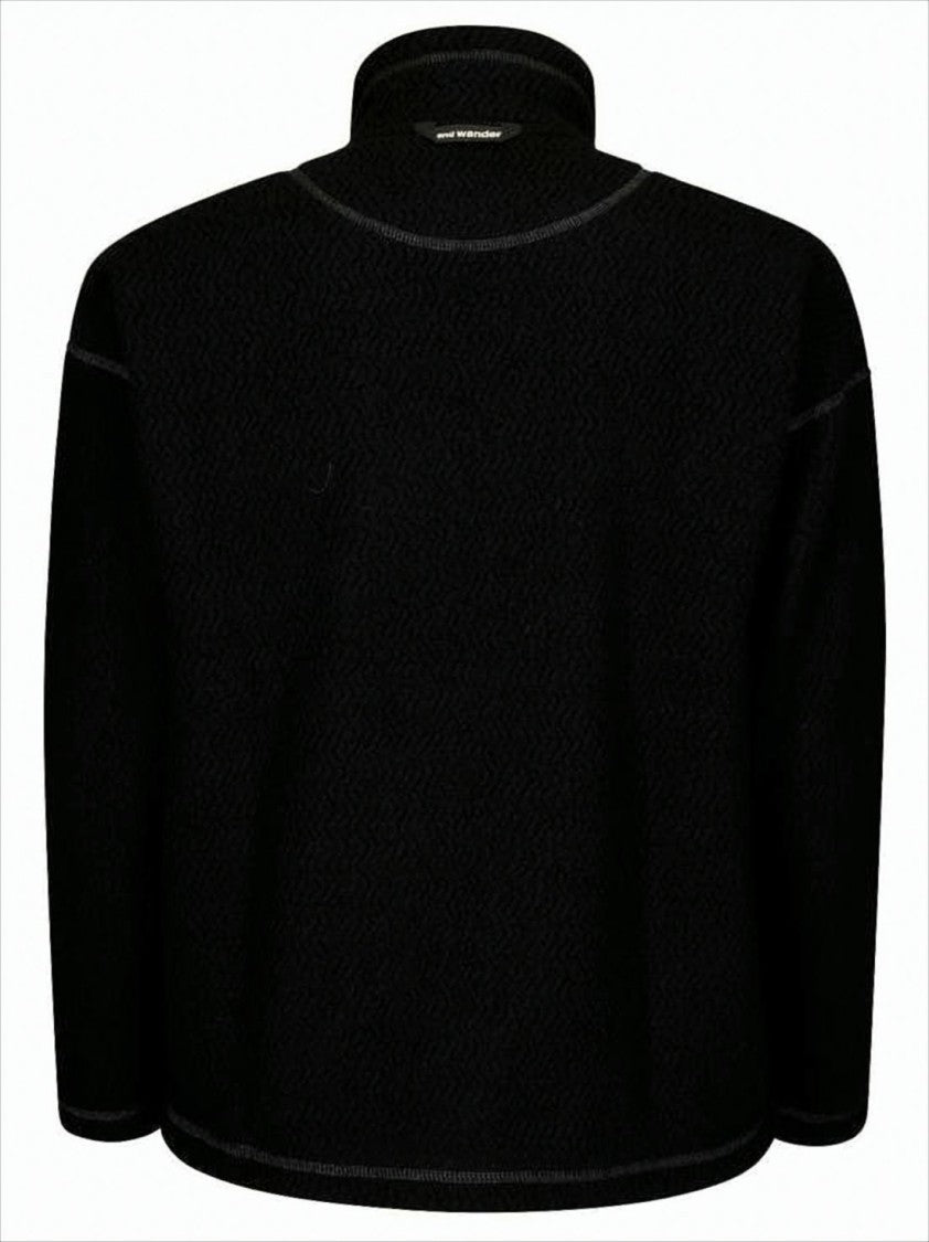 Textured Black Jacket With High Collar And Unique Pocket Design