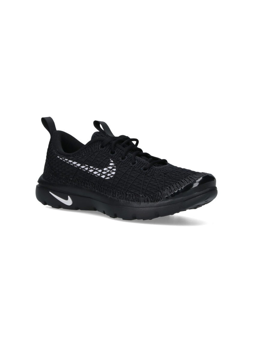 Textured Black Sneakers With Low-Profile Design And Distinctive Branding