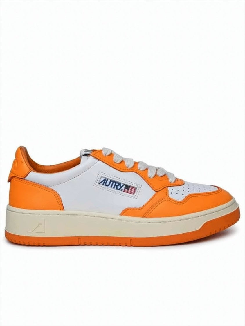 Low-Top Sneakers with Vibrant Orange Overlays and Perforated Detailing