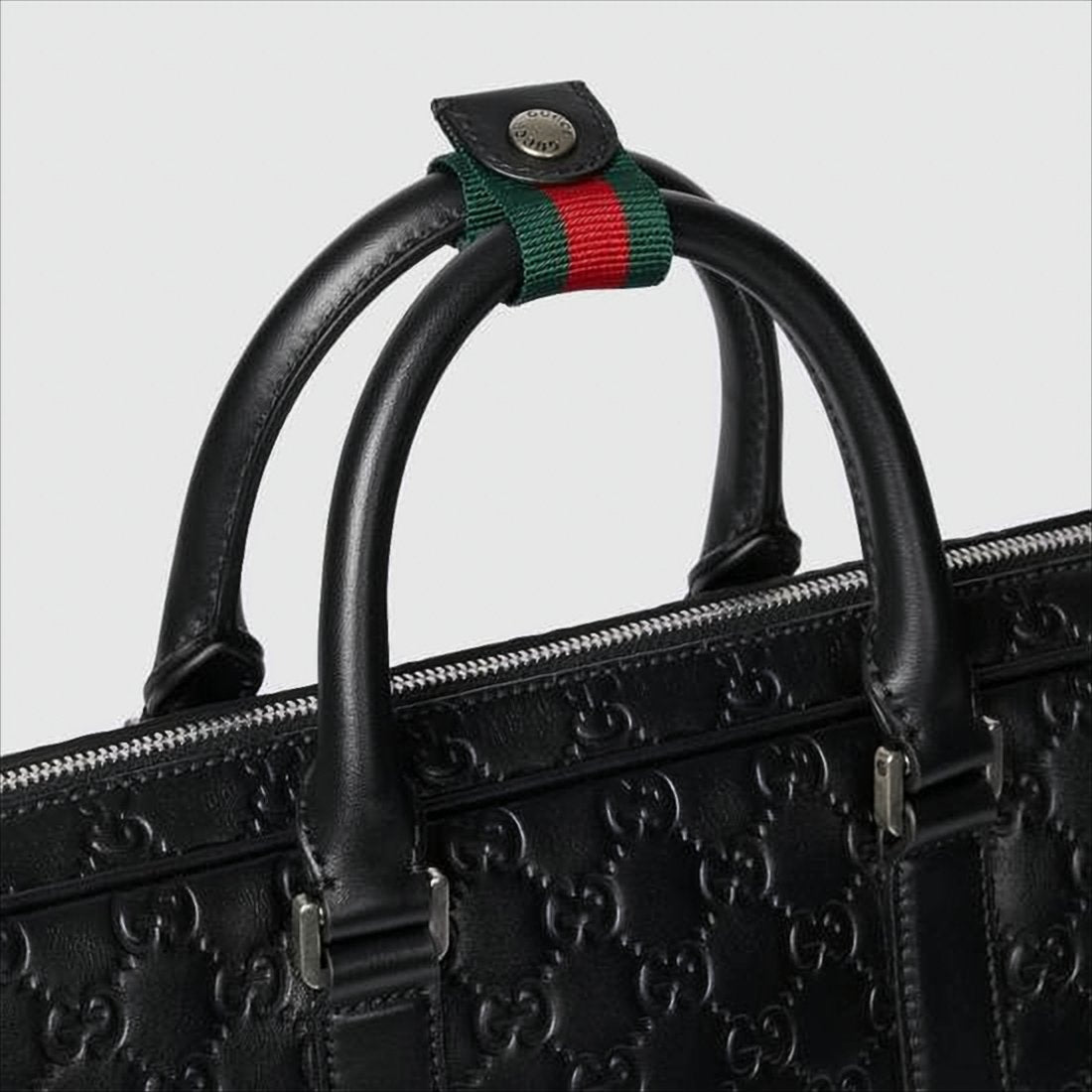 Embossed Black Leather Tote Bag with Signature Detail