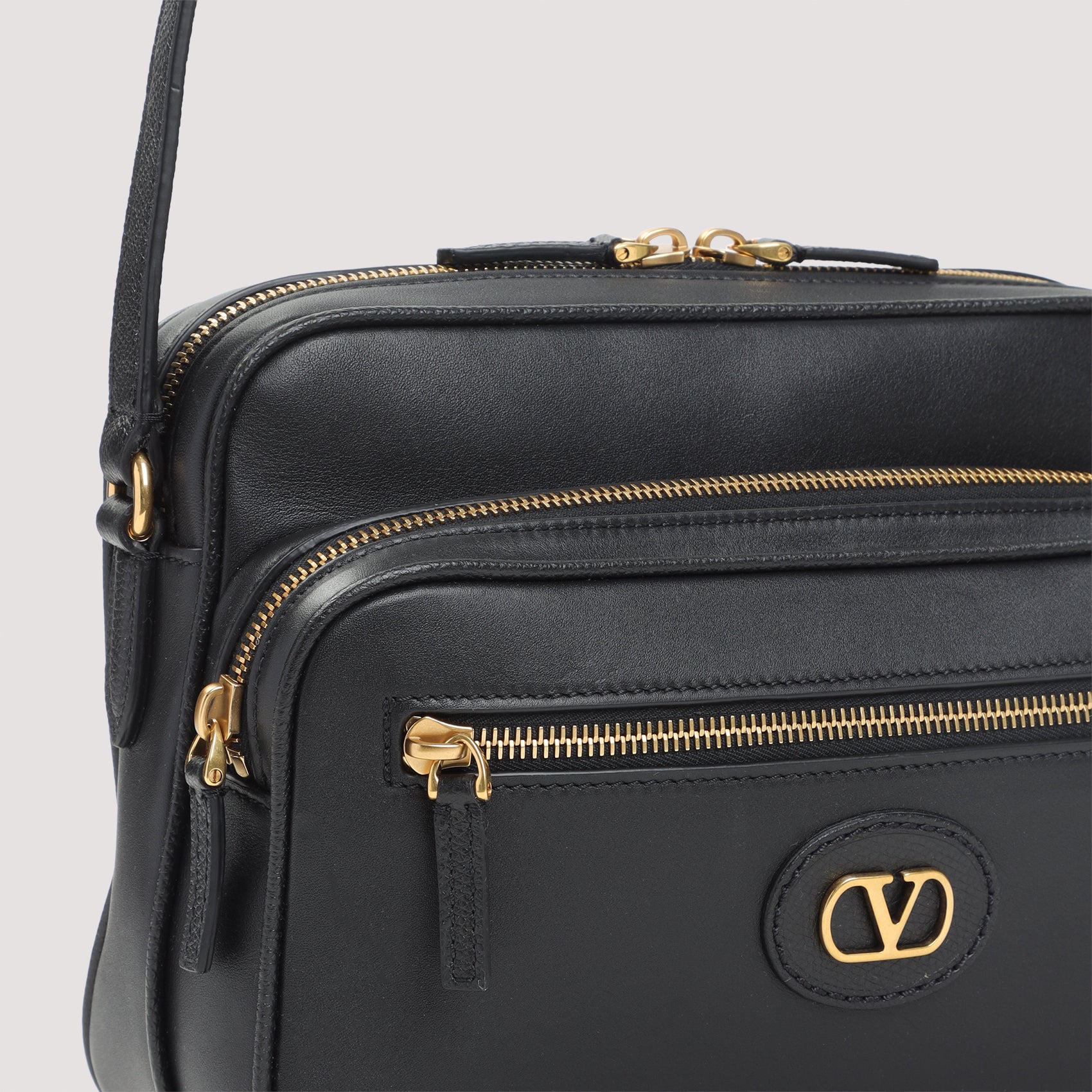 Rectangular Black Leather Crossbody Bag With Gold Accents