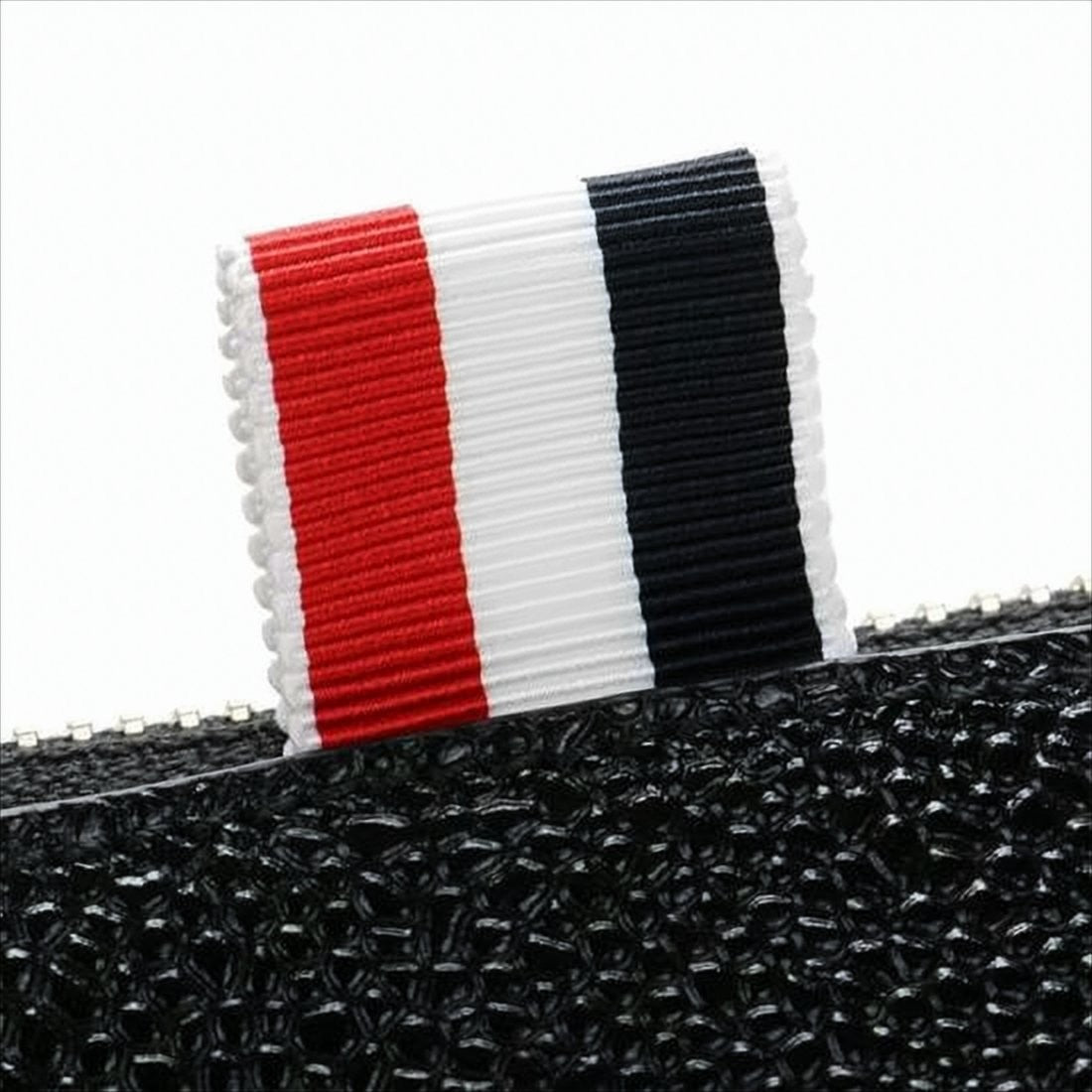Textured Leather Clutch with Gold-Zipper Closure and Tricolor Accents