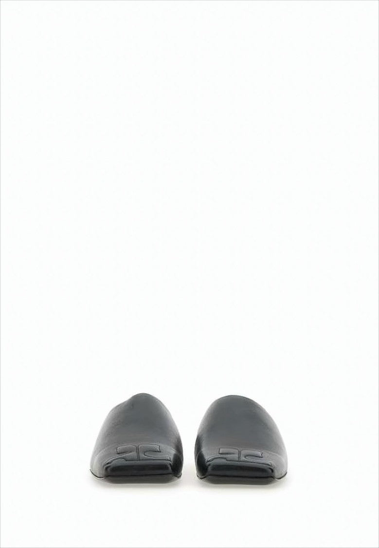 Minimalist Black Lambskin Slip-On Mules with Embossed Detail