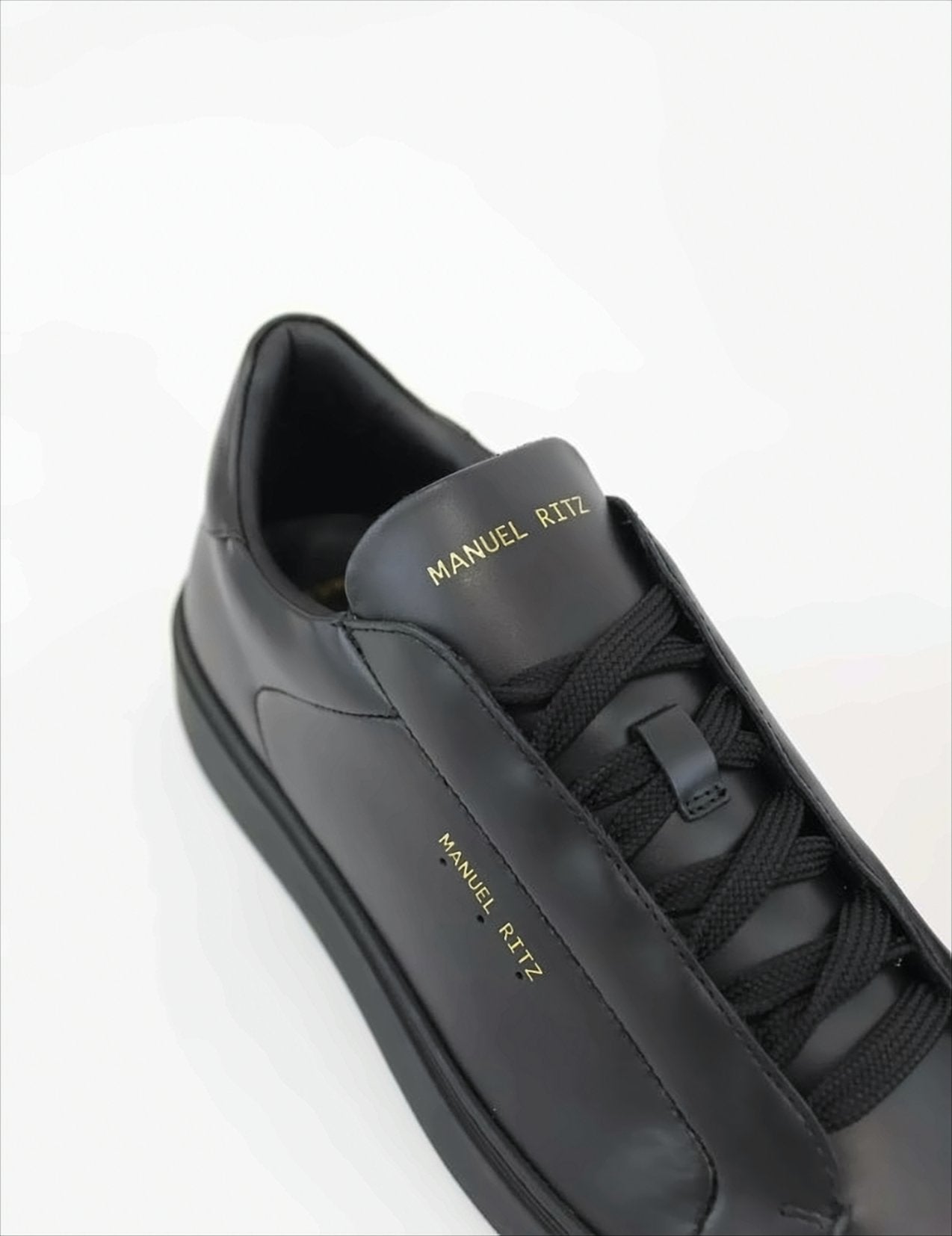 Black Sneakers With Gold Accents