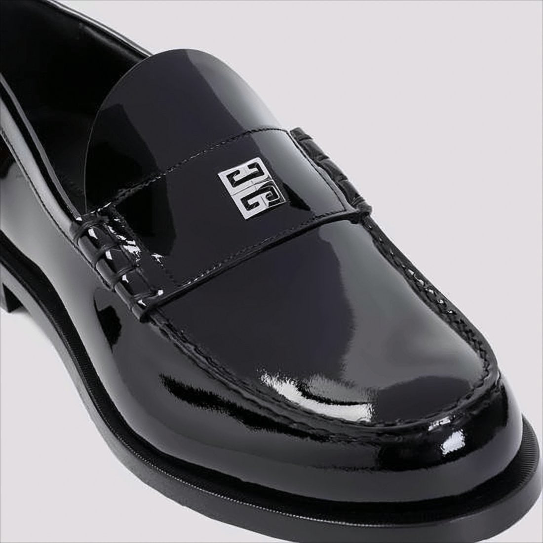 Glossy Black Moc Toe Loafers with Metallic Details