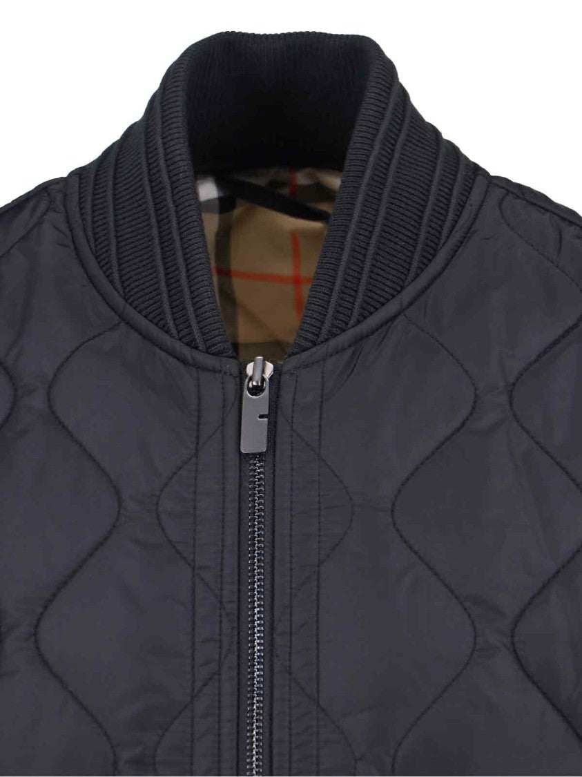 Structured Black Jacket With High Collar And Minimalist Design