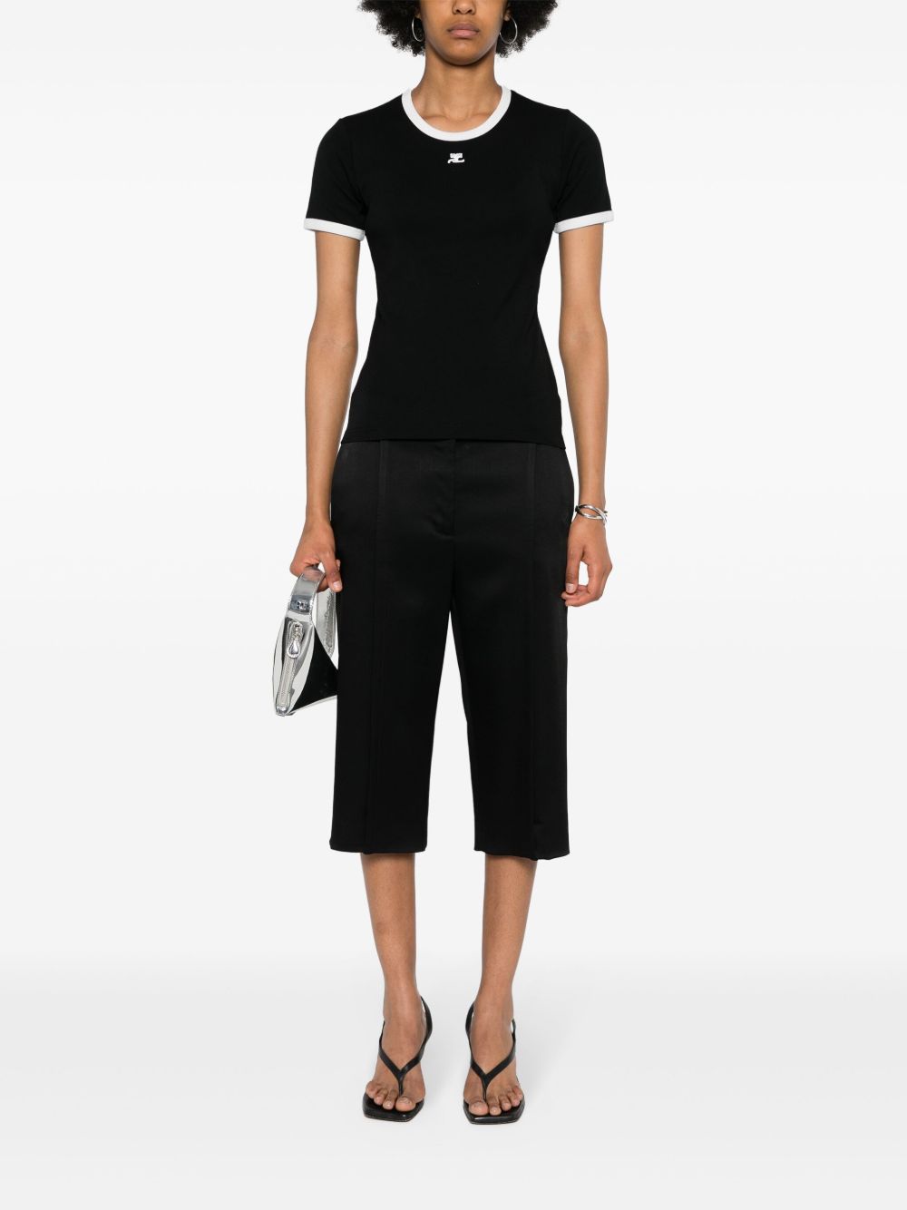 Fitted Black Top With Contrast Trim And Subtle Logo