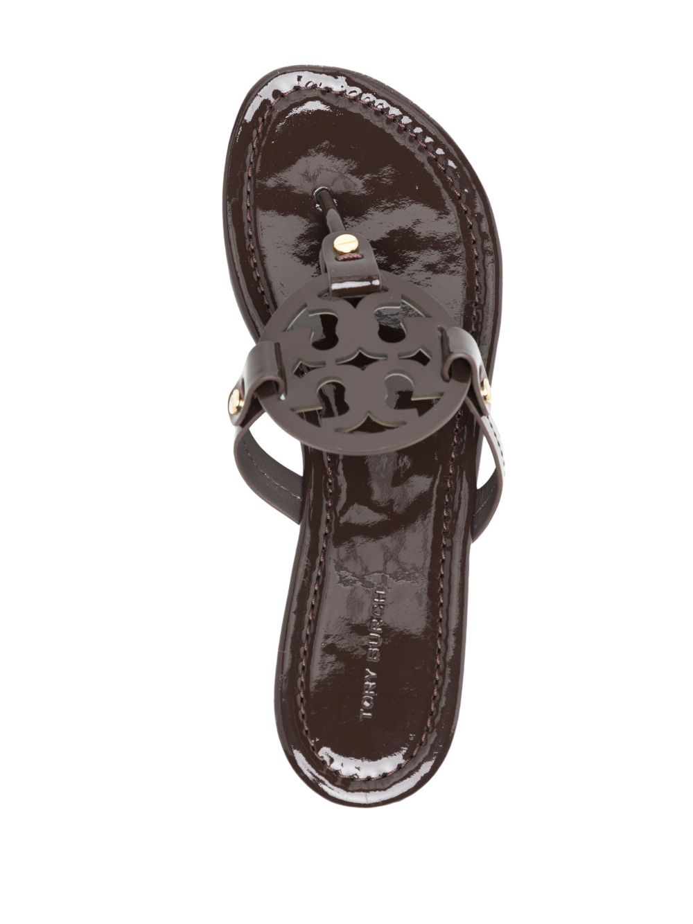 Glossy Black Flats With Circular Emblem Detail