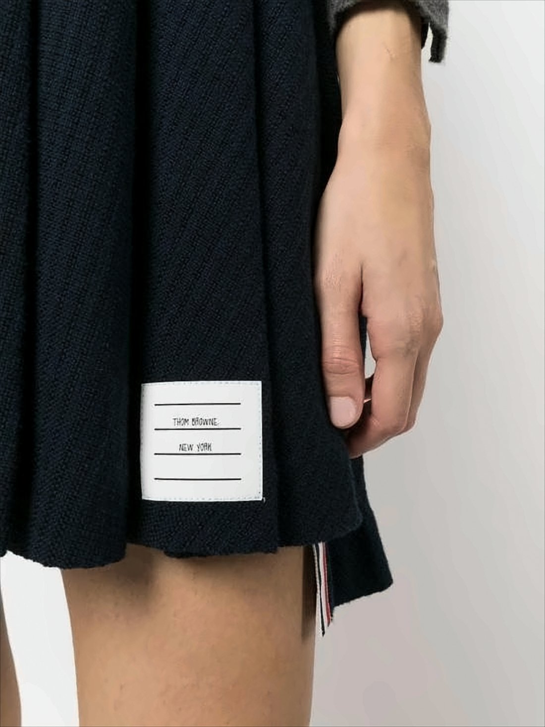 Pleated Mini Skirt with Structured Waistband and Striped Trim