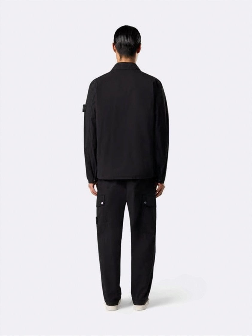Black Jacket with Classic Collar and Distinctive Patch