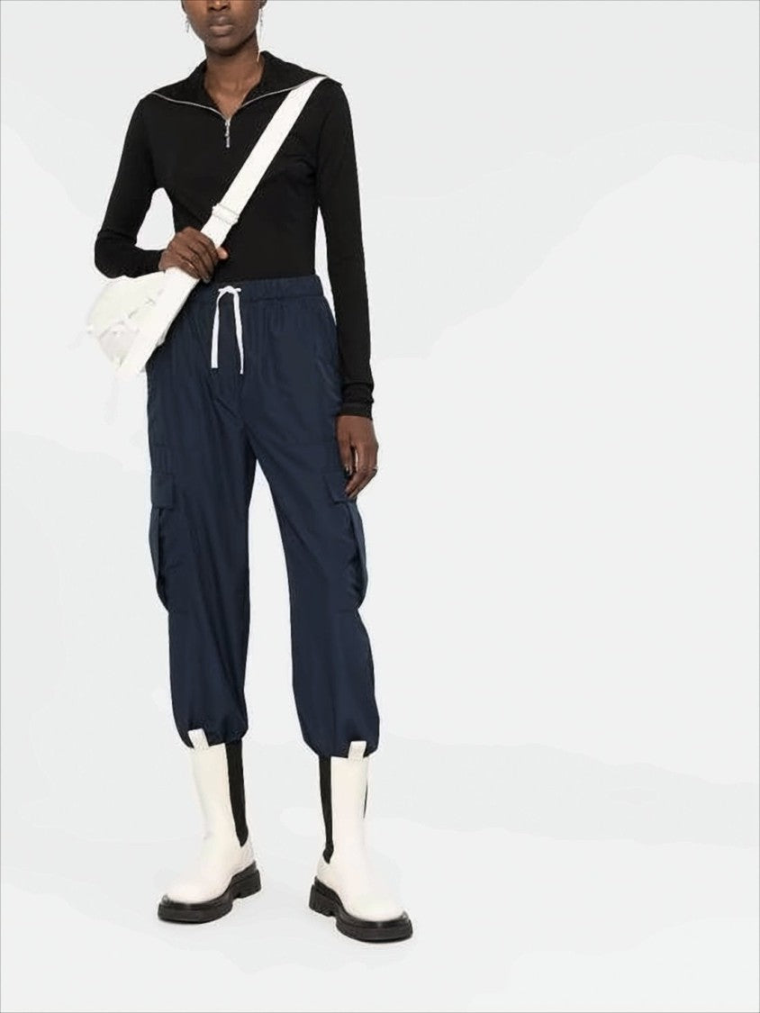 Fitted Turtleneck with Half-Zip Closure and Subtle Branding