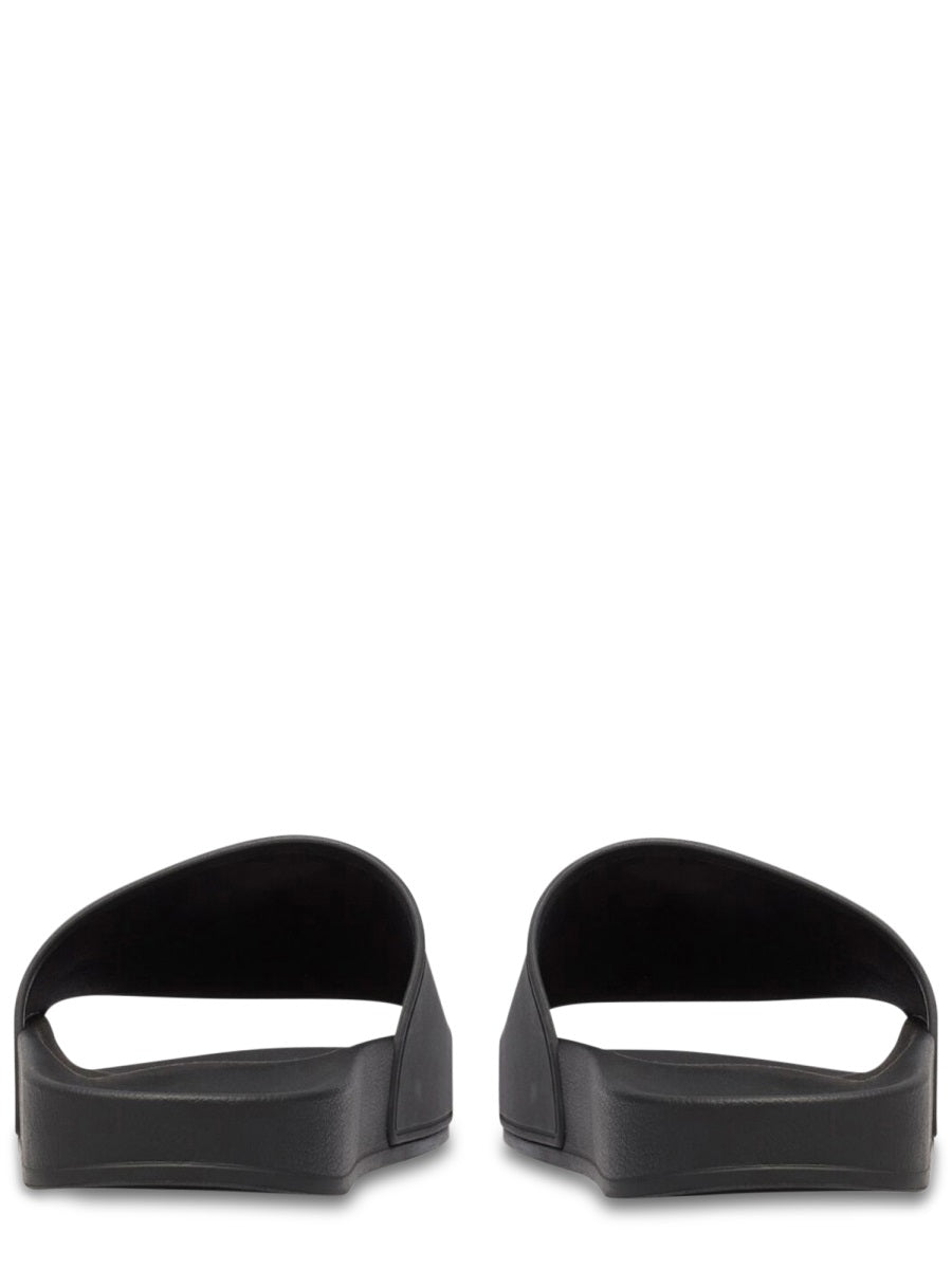 Contoured Black Slip-On Sandal With Bold Logo Print
