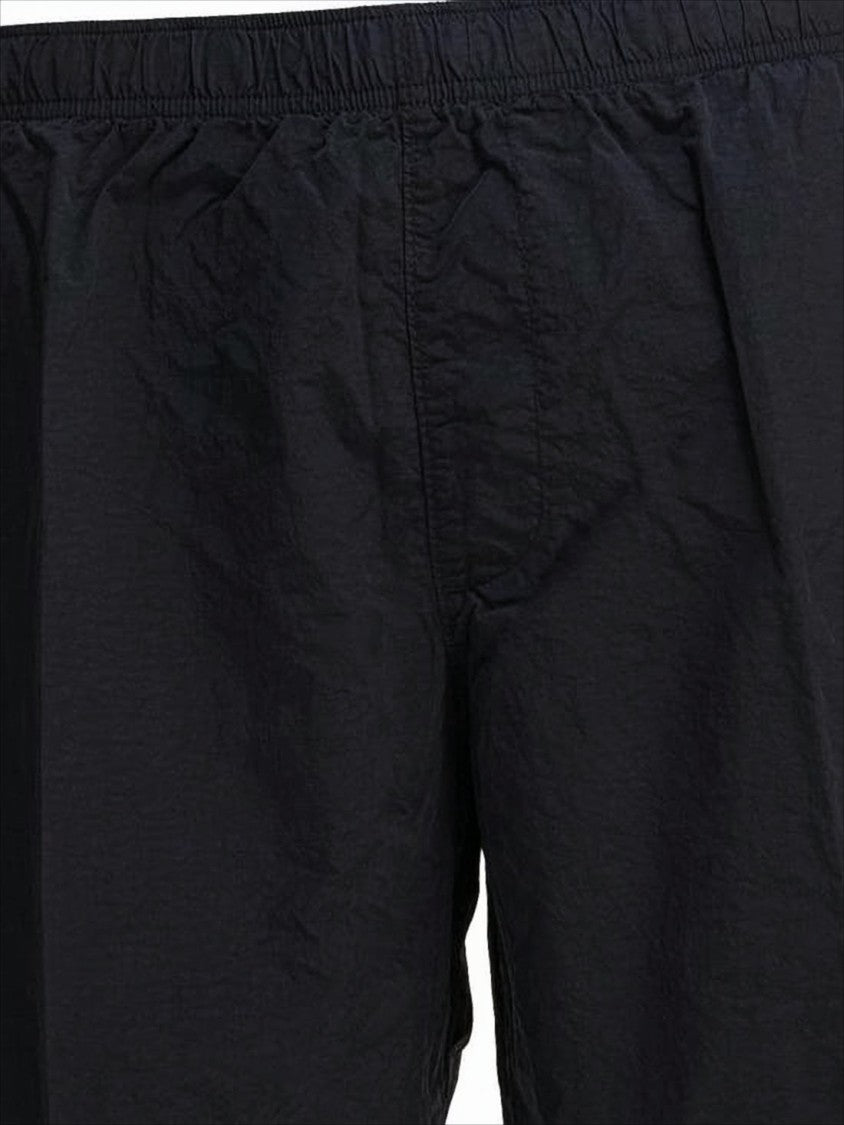 Black Minimalist Beach Shorts with Unique Lens Detail