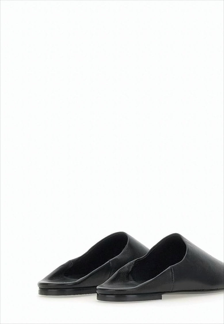 Minimalist Black Lambskin Slip-On Mules with Embossed Detail