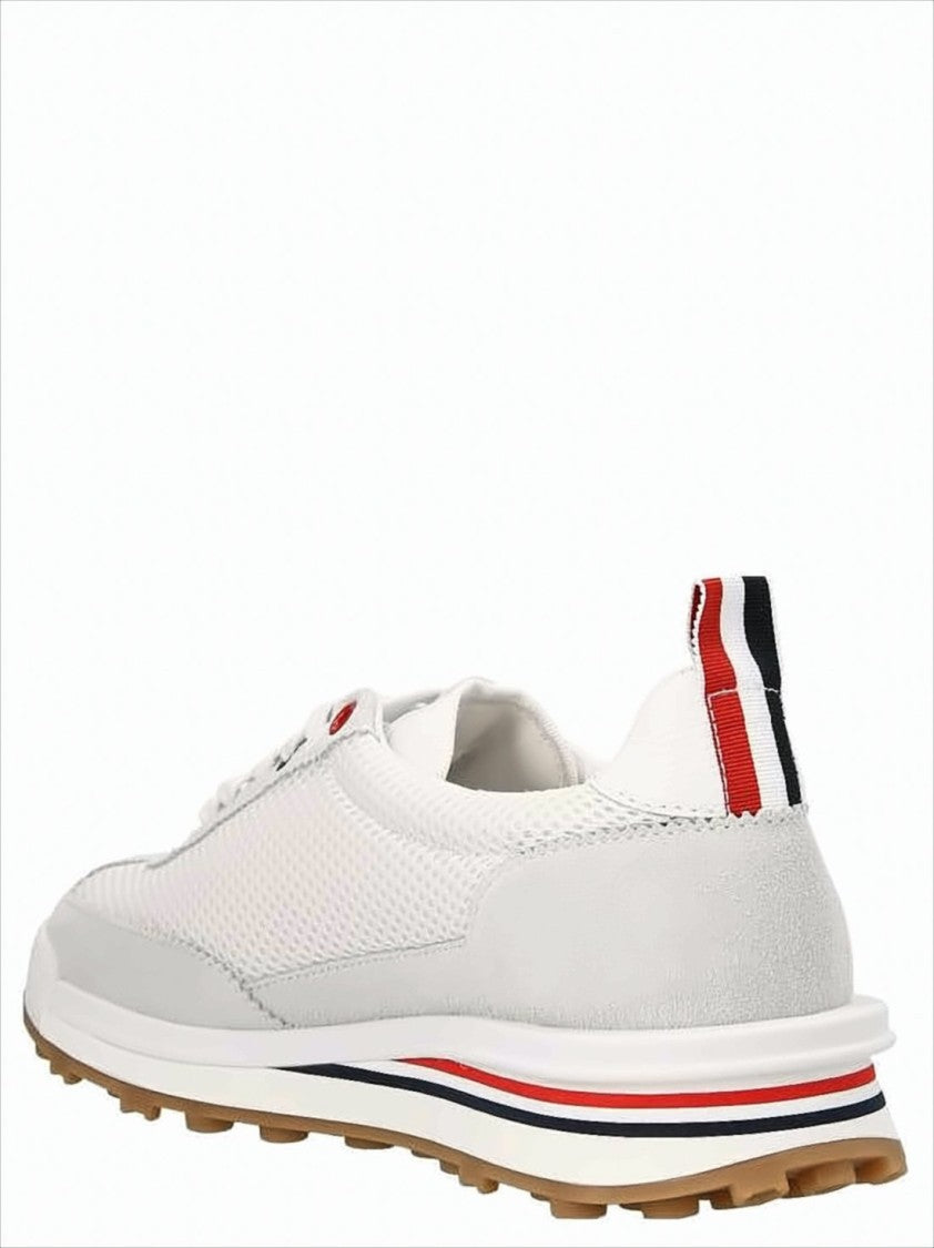 White Sneakers with Suede Overlays and Striped Detailing