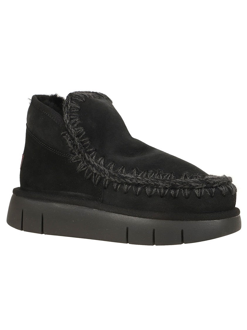Moccasin-Inspired Ankle Boots with Whipstitch Detailing