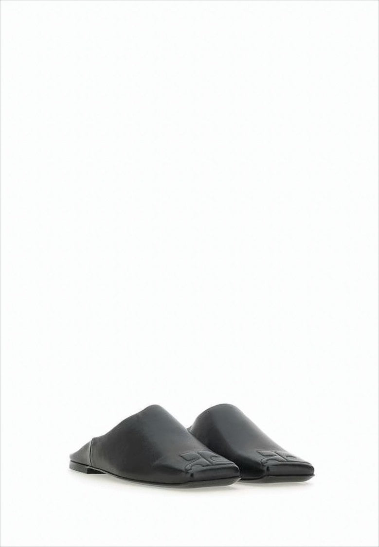 Minimalist Black Lambskin Slip-On Mules with Embossed Detail