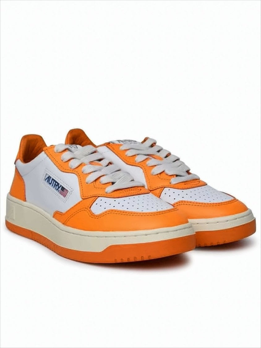 Low-Top Sneakers with Vibrant Orange Overlays and Perforated Detailing