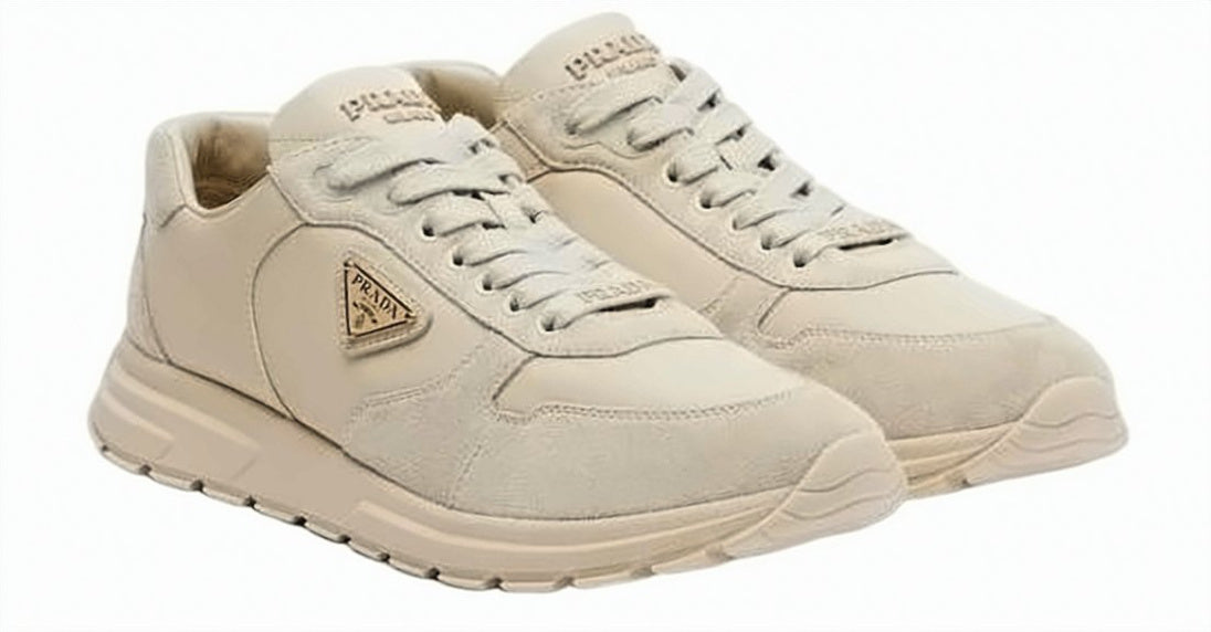 Chunky Beige Sneakers with Textured Accents and Triangular Logo
