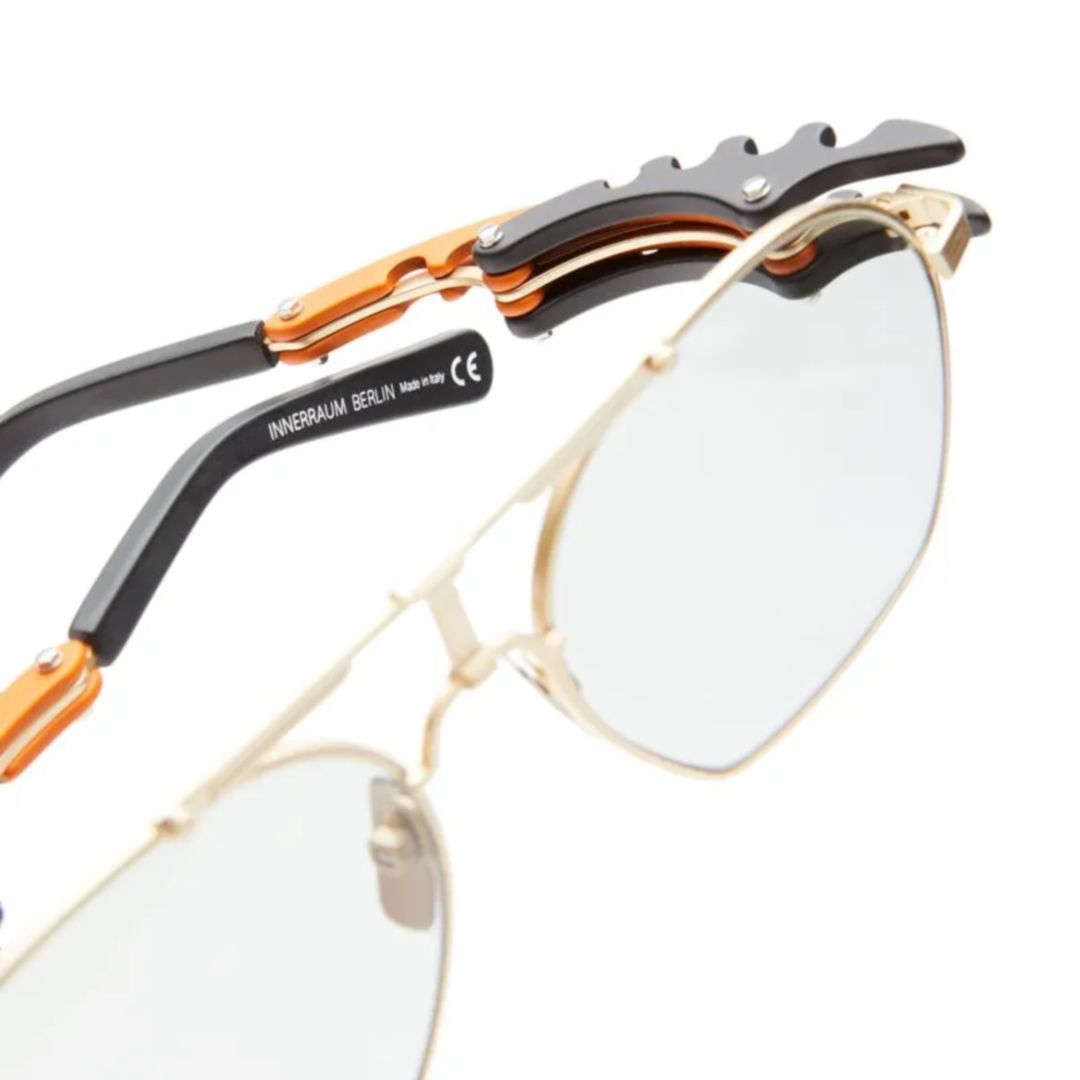 O24 Geometric Gold-tone Metal Eyeglasses with Architectural Temples