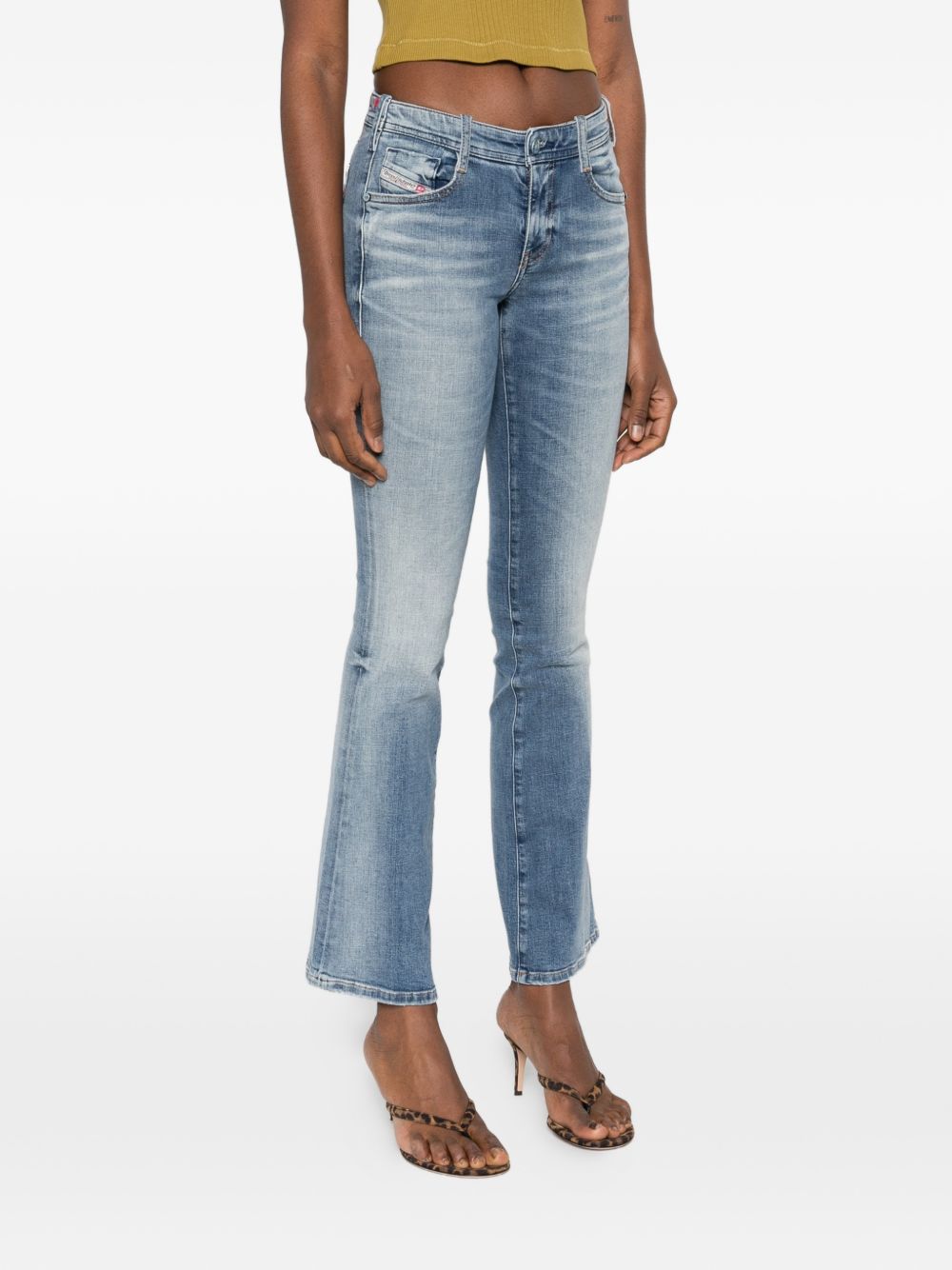 Faded Blue Denim Jeans with Flared Silhouette