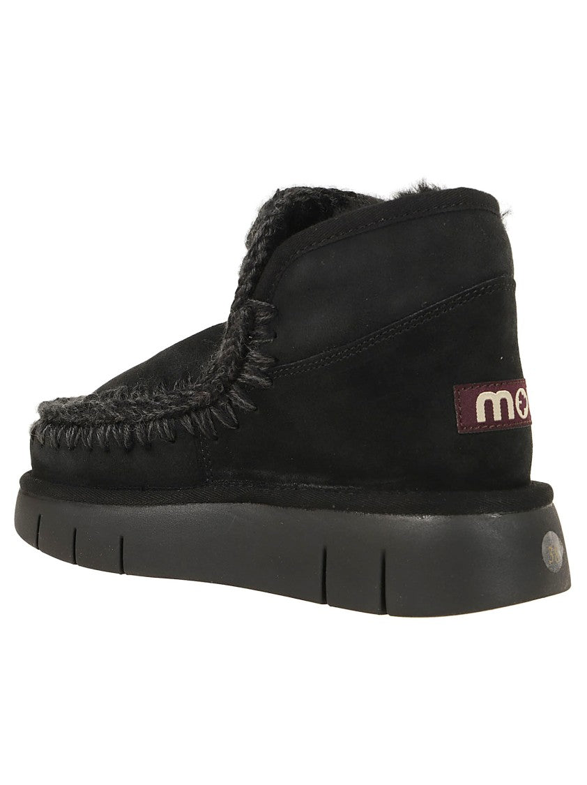 Moccasin-Inspired Ankle Boots with Whipstitch Detailing