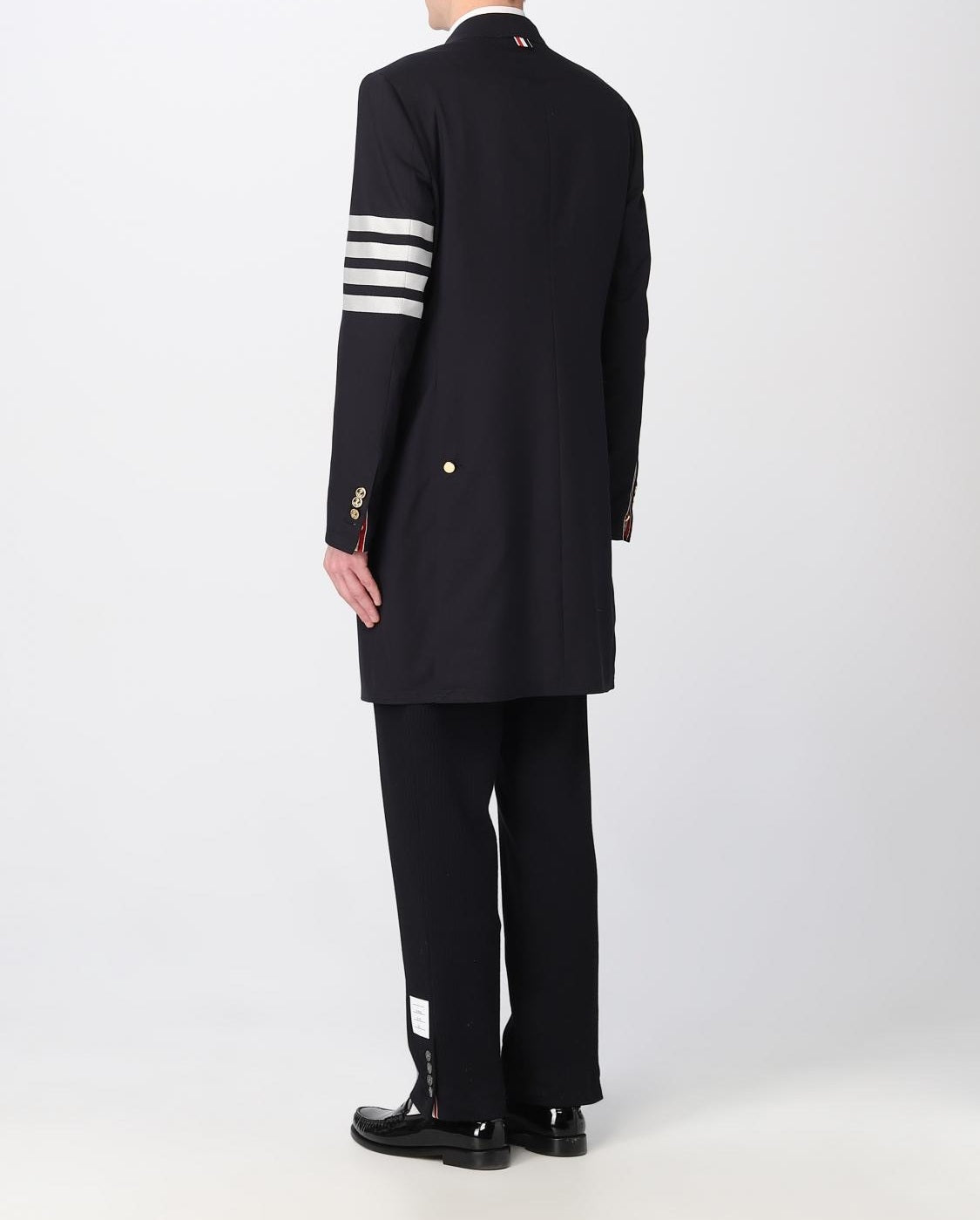 Tailored Black Coat with Asymmetrical Front and Signature Stripe