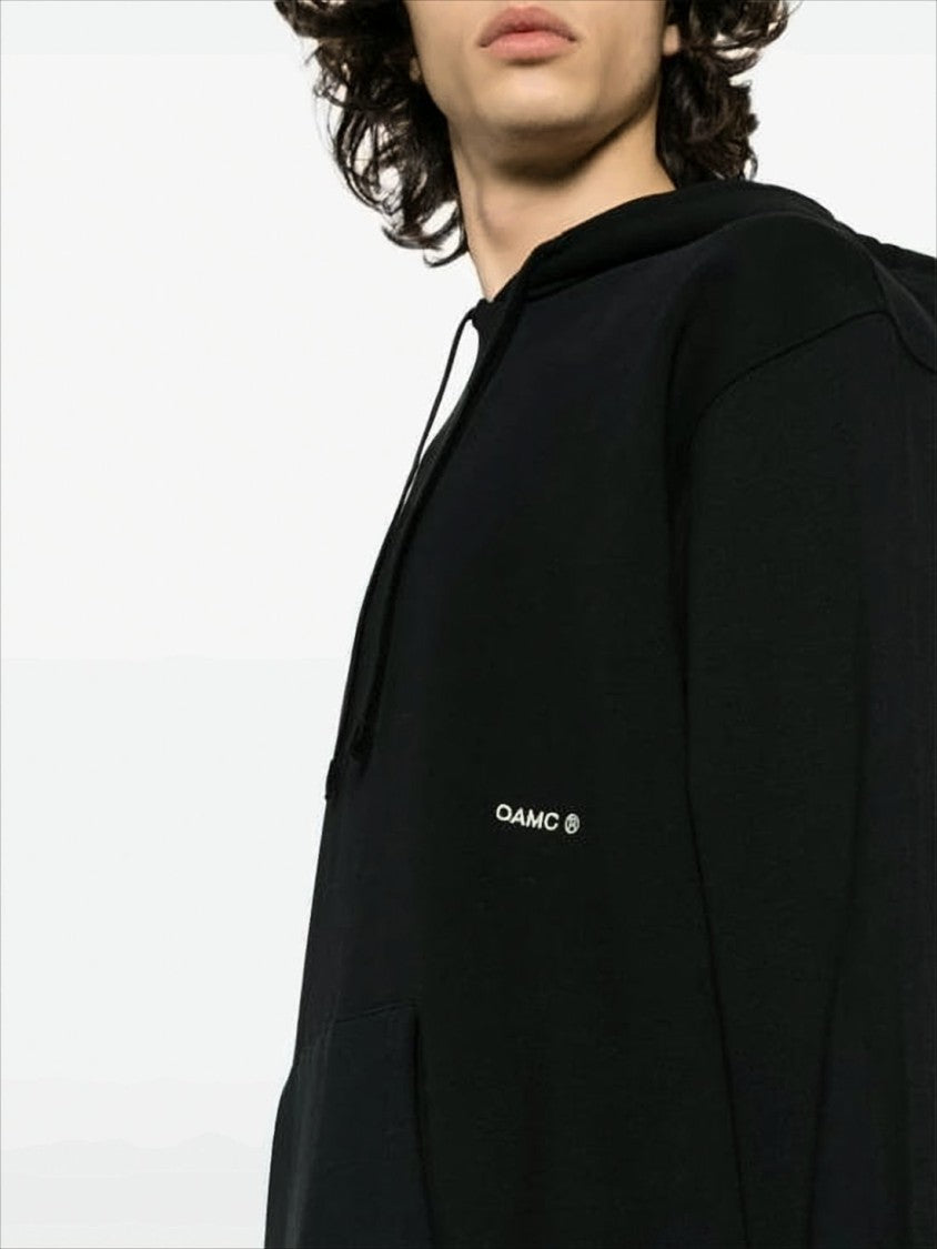Relaxed-Fit Black Hoodie with Circular Graphic Design