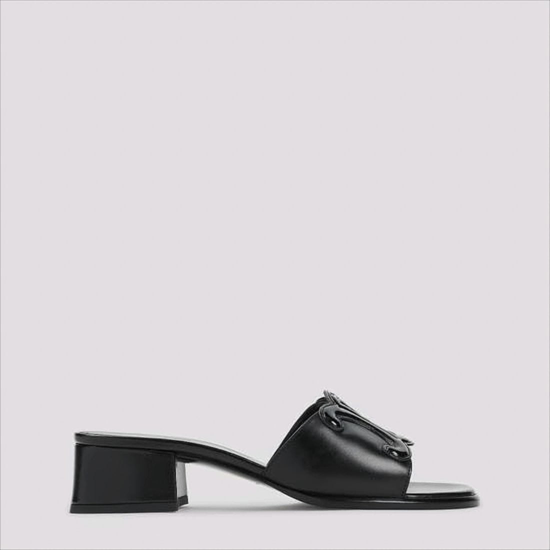 Open Toe Mules With Glossy Emblem Detail