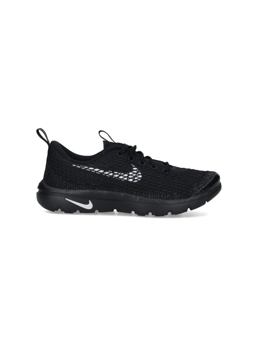 Textured Black Sneakers With Low-Profile Design And Distinctive Branding