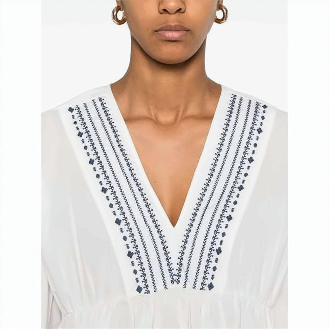 Flowing White Blouse with Blue Embroidery