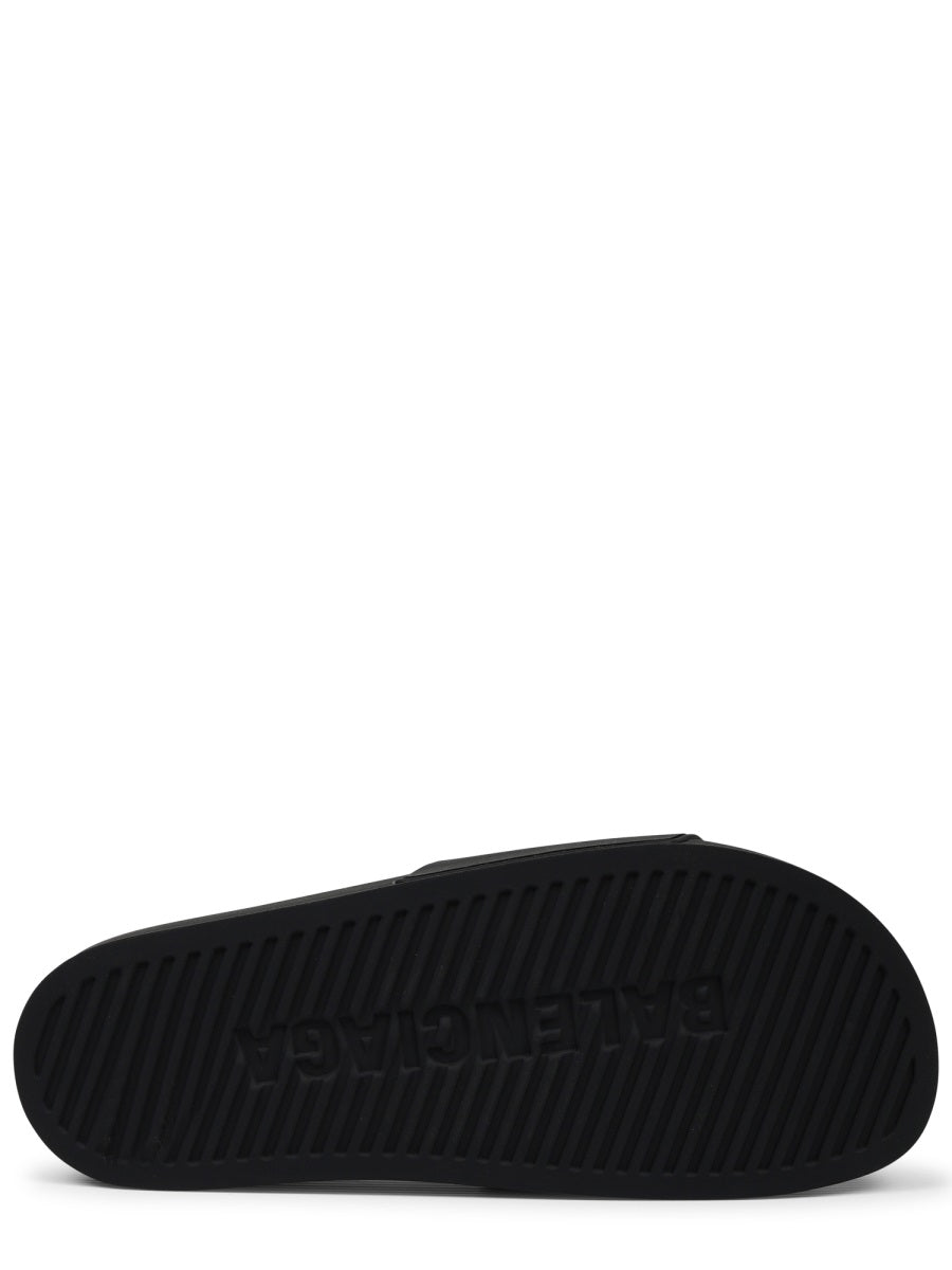 Contoured Black Slip-On Sandal With Bold Logo Print