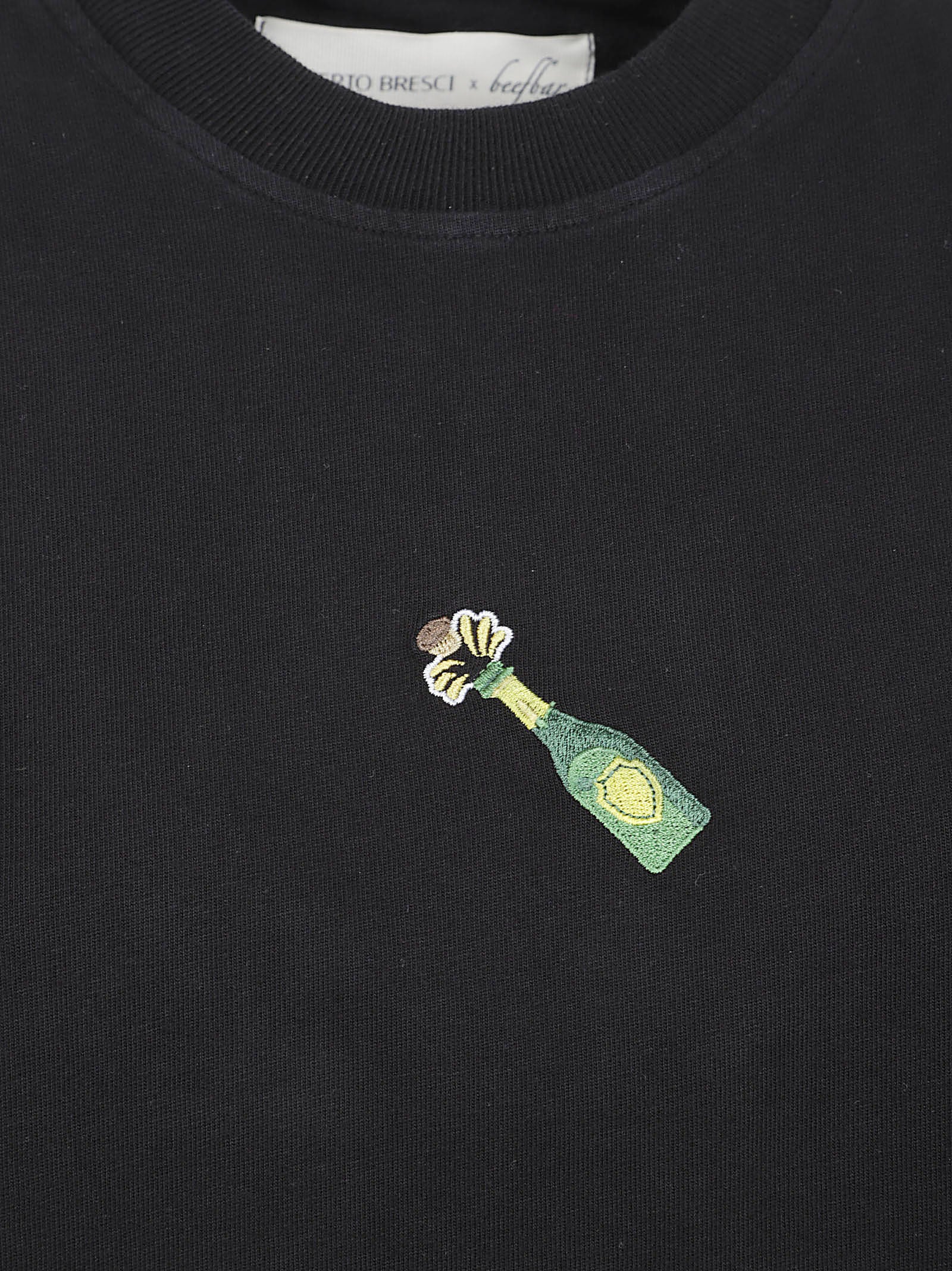 Relaxed Fit Black T-Shirt with Embroidered Bottle Design