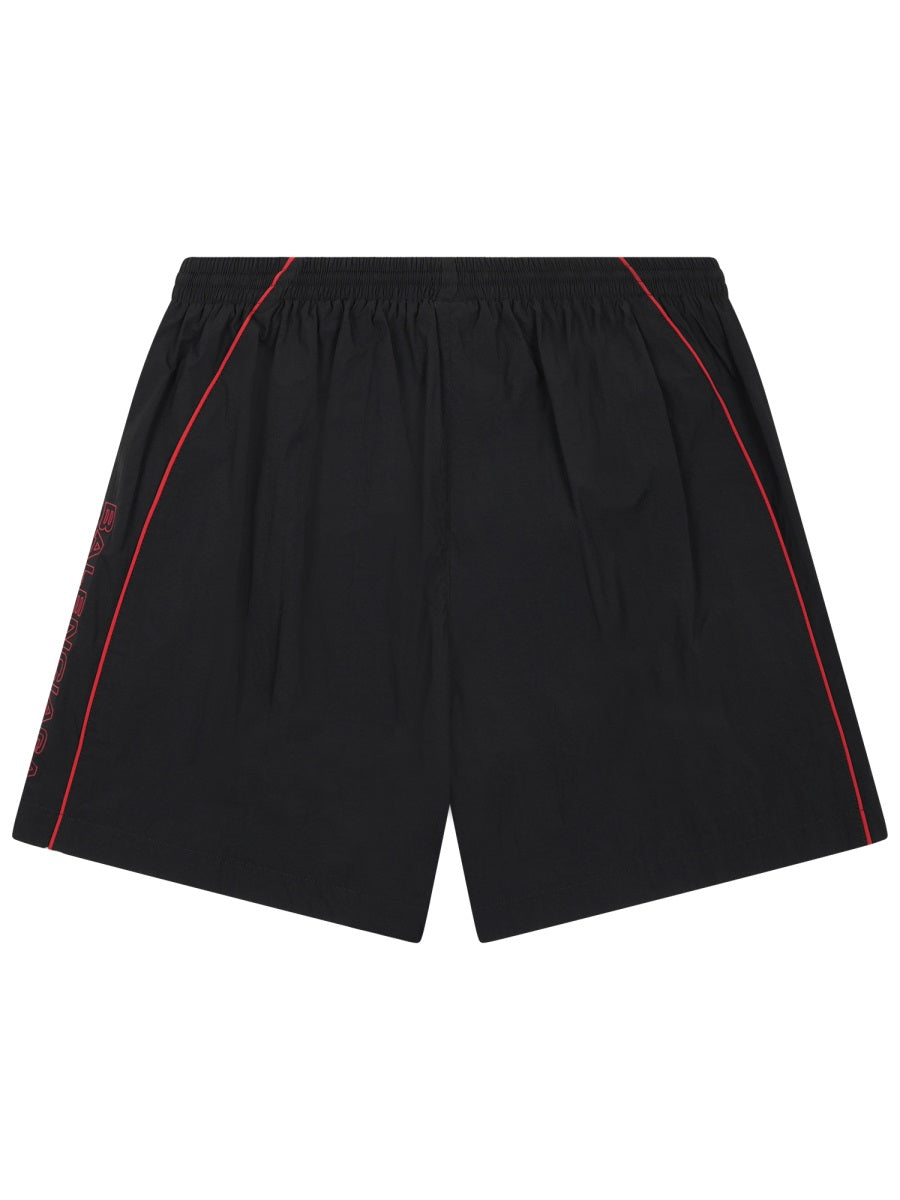 Sleek Black Sports Shorts With Red Piping