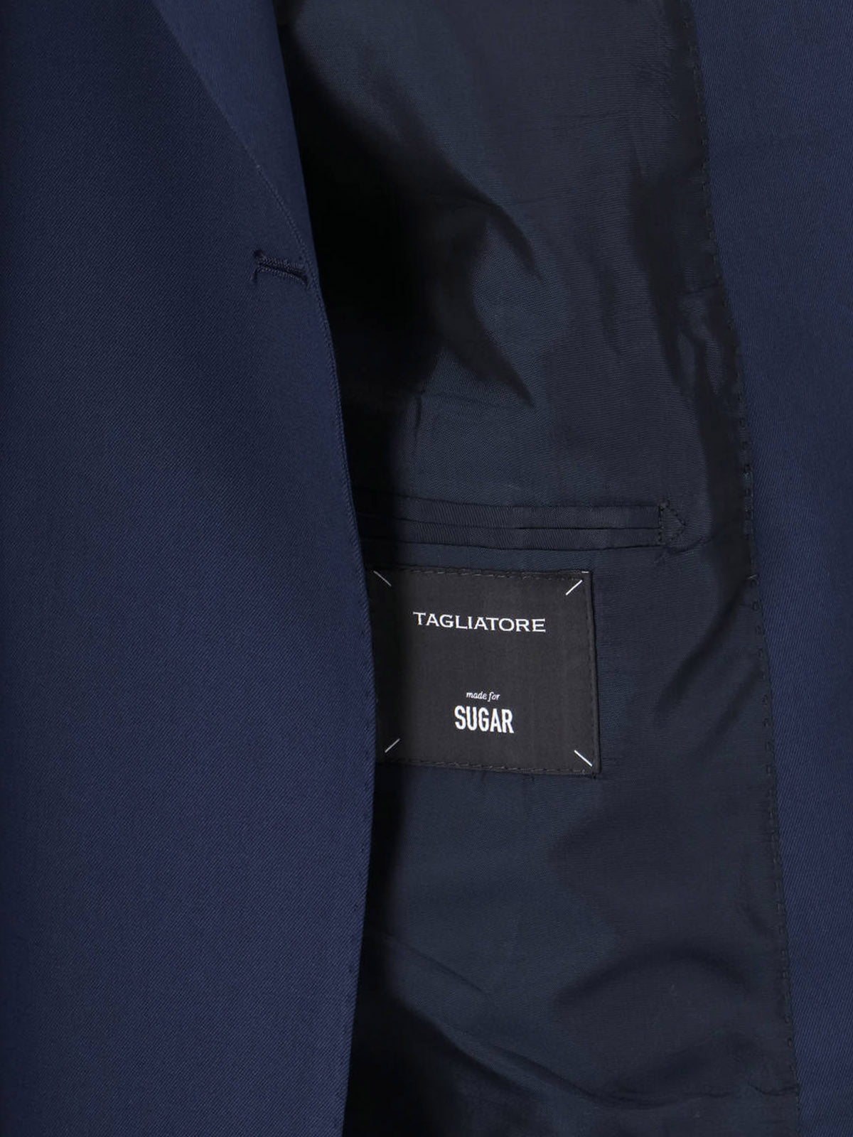 Tailored Black Dress With Notched Lapel And Structured Silhouette