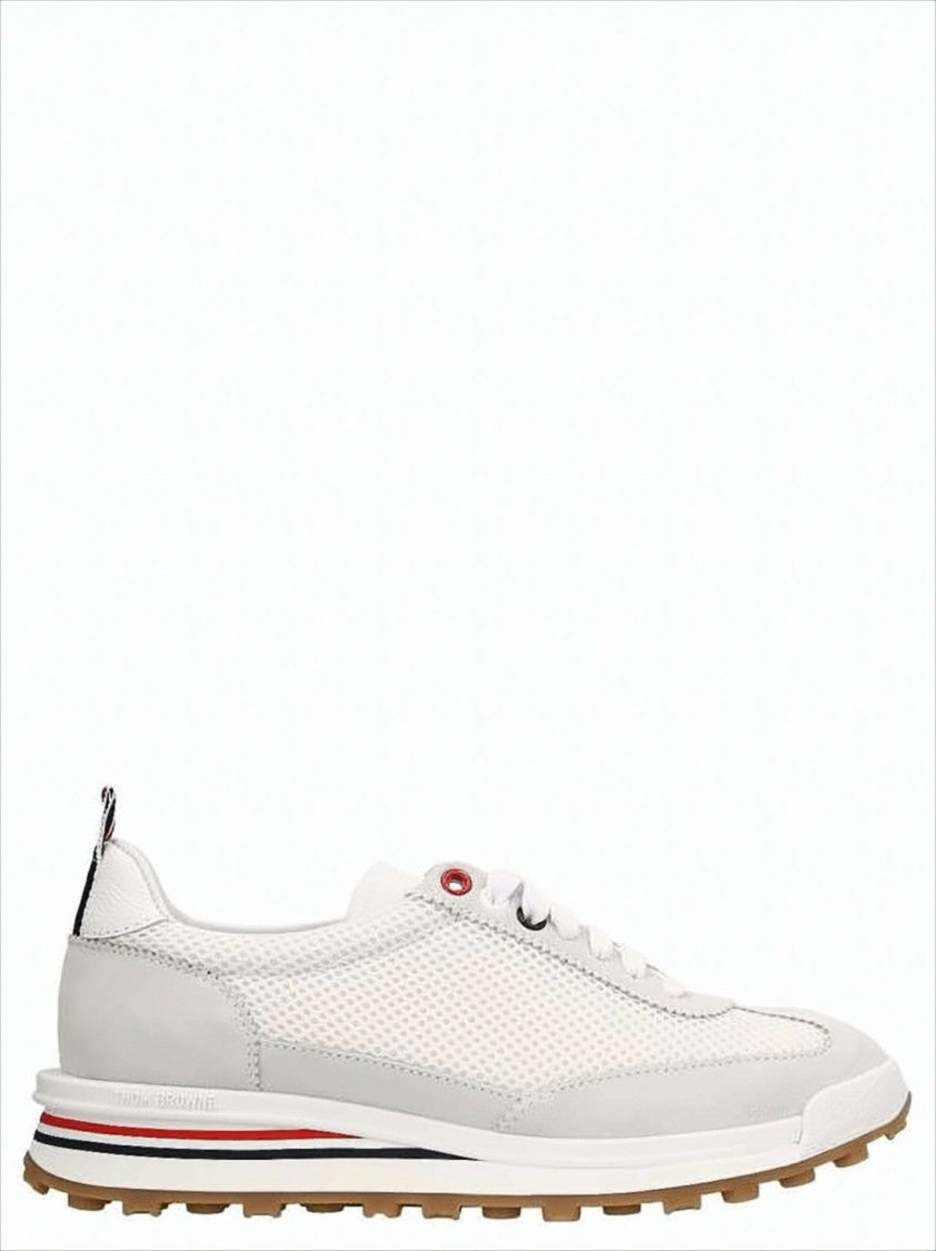 White Sneakers with Suede Overlays and Striped Detailing