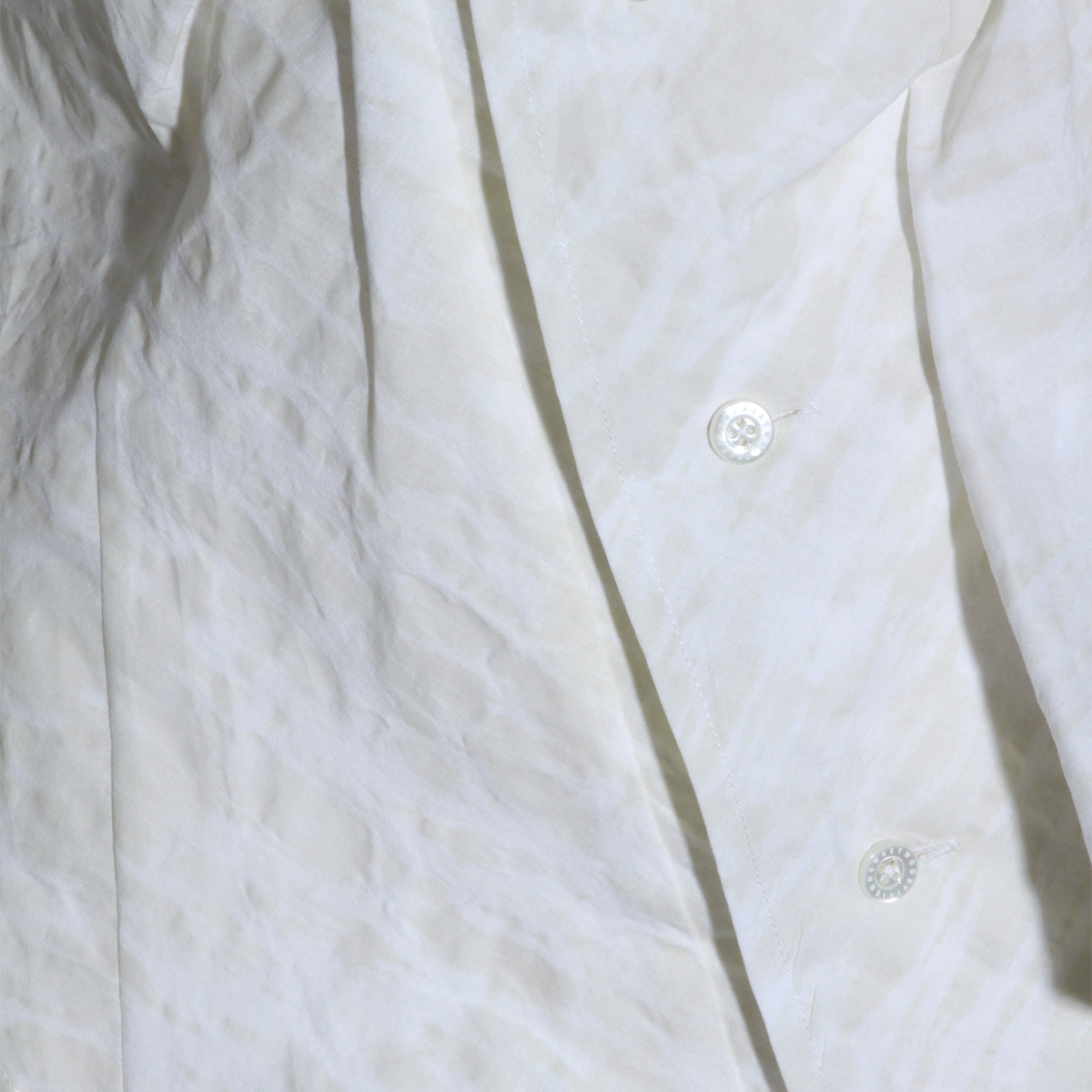 Sleeveless White Shirt with Draped Front