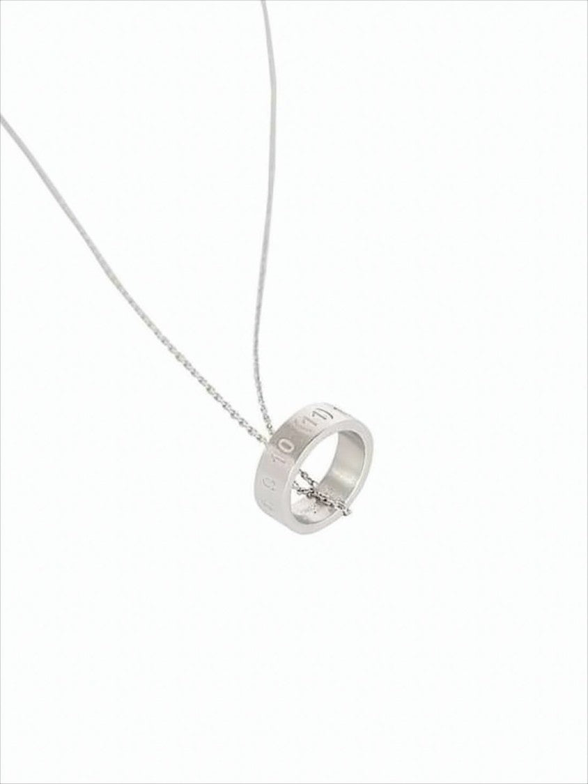 Delicate Silver Necklace With Circular Pendant And Engraved Details