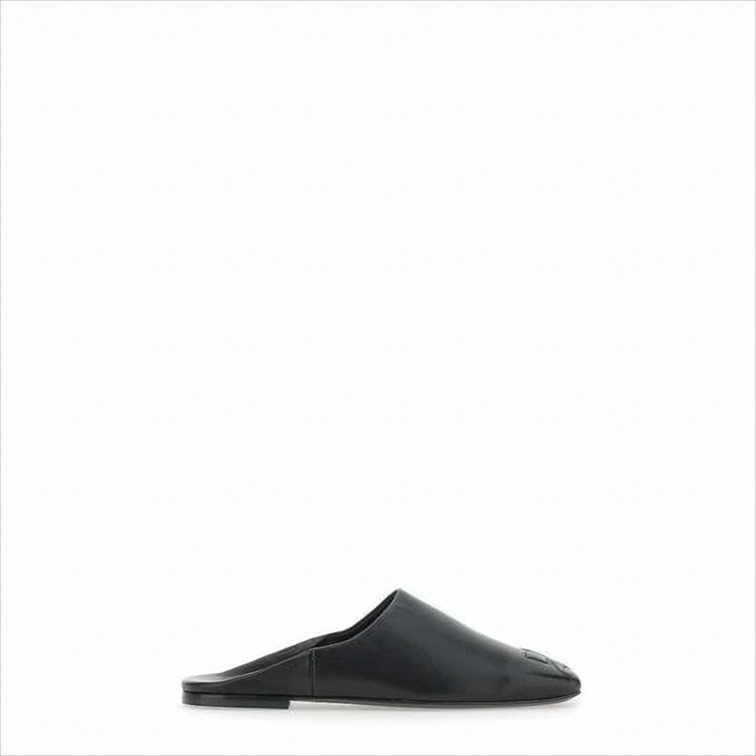Minimalist Black Lambskin Slip-On Mules with Embossed Detail