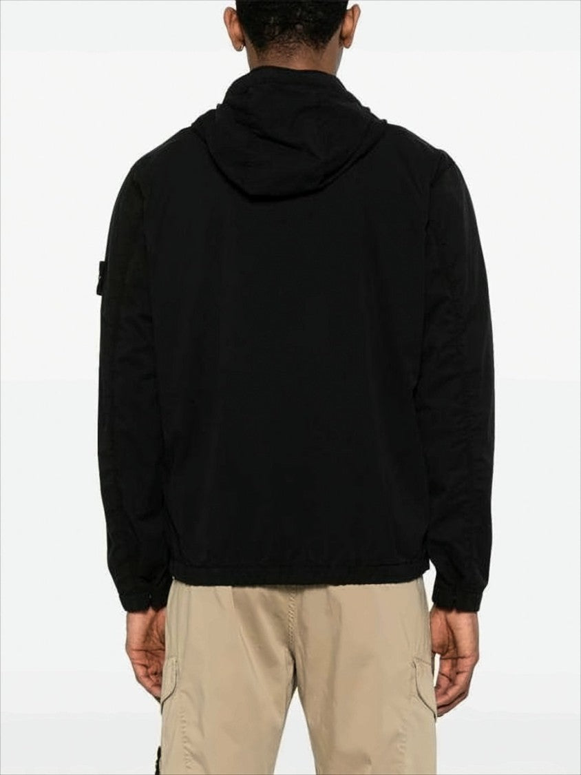 Minimalist Black Jacket with Distinctive Patch Logo