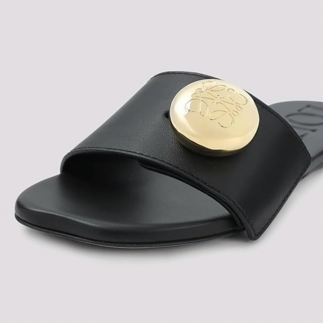 Minimalist Black Slide Sandals with Gold-tone Medallion