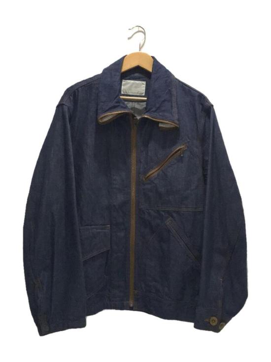 Structured Blue Denim Jacket with Front Zipper Closure and Angular Pockets