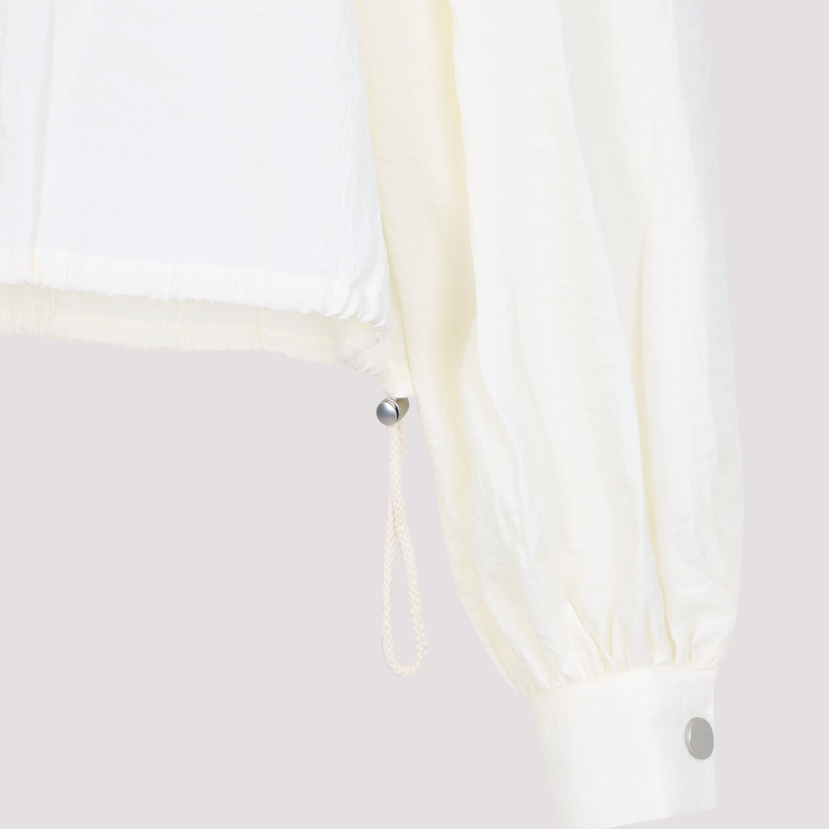Long-Sleeved White Top with Adjustable Hem